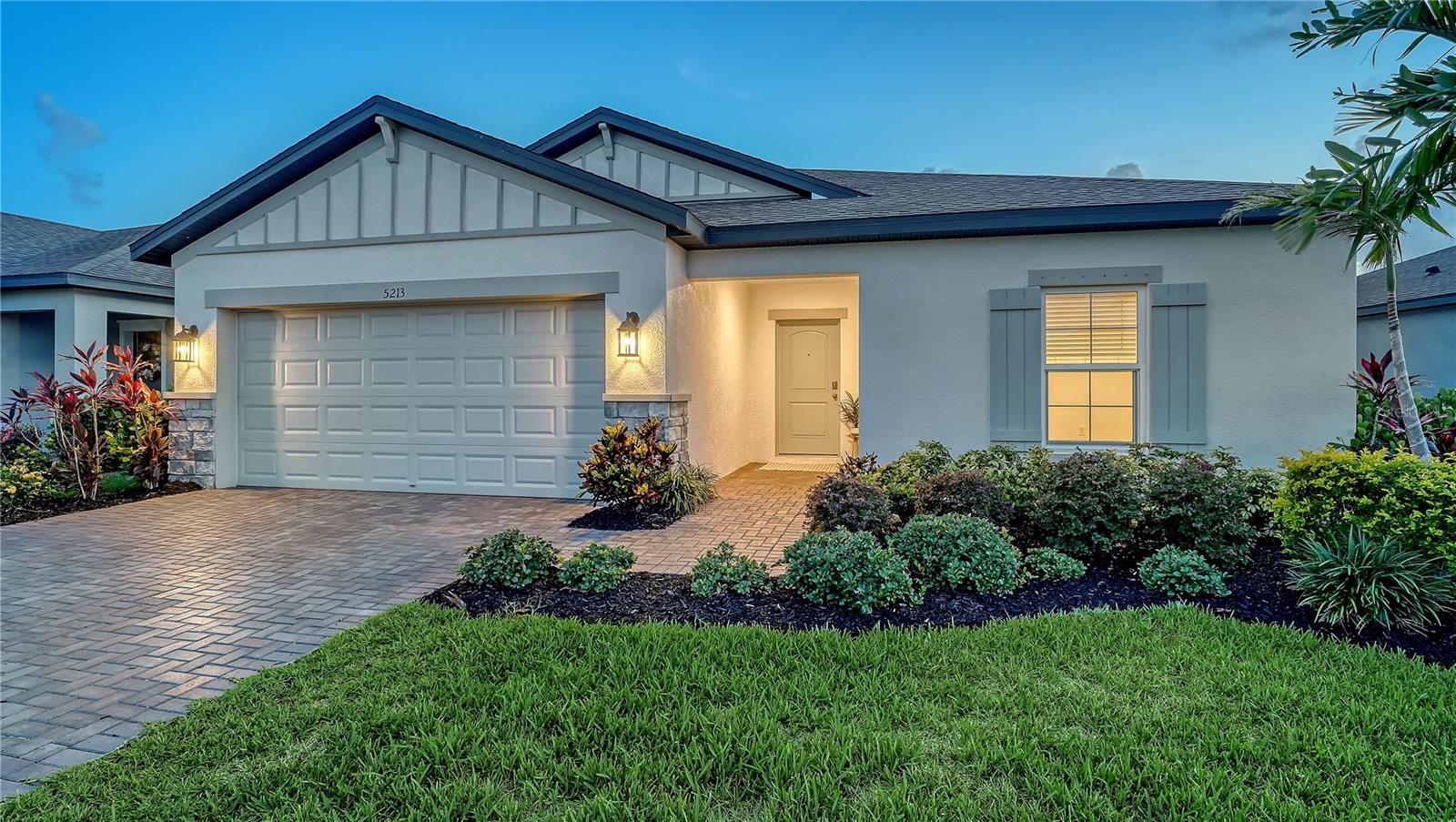 Why wait to build when you can move right into this beautifully upgraded 2023-built lakefront home in the highly sought-after resort-style community of Trevesta? Perfectly situated on a premium waterfront homesite, this move-in-ready residence offers the ideal blend of modern design, luxury finishes, and everyday convenience.



Designed with an open-concept layout and desirable split-bedroom floor plan, this thoughtfully crafted one-story home provides both comfort and functionality. The chef-inspired kitchen is the heart of the home, featuring quartz countertops, a spacious center island with bar seating, stainless steel appliances, abundant cabinetry, and a large walk-in pantry. The adjoining dining and living areas flow seamlessly to the covered, no-see-um screened lanai, creating the perfect setting for indoor-outdoor living while showcasing peaceful lake views.



Privately tucked away, the spacious primary suite serves as a relaxing retreat with a tray ceiling, generous walk-in closet with custom organization, dual undermount sinks with quartz countertops, and an oversized tiled walk-in shower. Three additional bedrooms provide flexibility for guests, family members, or a dedicated home office. The secondary bath is equally impressive with quartz countertops, an undermount sink, and designer tile finishes.



The owners have thoughtfully enhanced this home with stylish, on-trend upgrades that make it truly move-in ready. Features include designer lighting, ceiling fans with remote controls, quartz countertops throughout, undermount sinks, premium tile flooring and shower surrounds, fresh interior paint, updated landscaping with fresh mulch, epoxy-coated garage flooring, and more.



Once outside, you can imagine creating your own tropical Florida paradise. The spacious backyard offers ample room to add a custom pool, outdoor kitchen, fire pit, or the outdoor living space you’ve always dreamed of—all while enjoying tranquil lake views and beautiful Florida sunsets.



Trevesta residents enjoy exceptional value, with HOA fees that include high-speed internet, cable television, and secured gated access. Residents also enjoy an impressive array of resort-style amenities, including a zero-entry pool with cabanas, splash pad, playground, lakeside walking trails, clubhouse, pavilion, 24-hour fitness center, and a vibrant calendar of community events and activities.



Conveniently located near major highways, shopping, dining, and top destinations including Bradenton, Sarasota, Lakewood Ranch, St. Petersburg, Tampa, and the world-famous Gulf Coast beaches, this home offers the perfect balance of luxury, lifestyle, and location.



Experience the best of Florida living in one exceptional home.