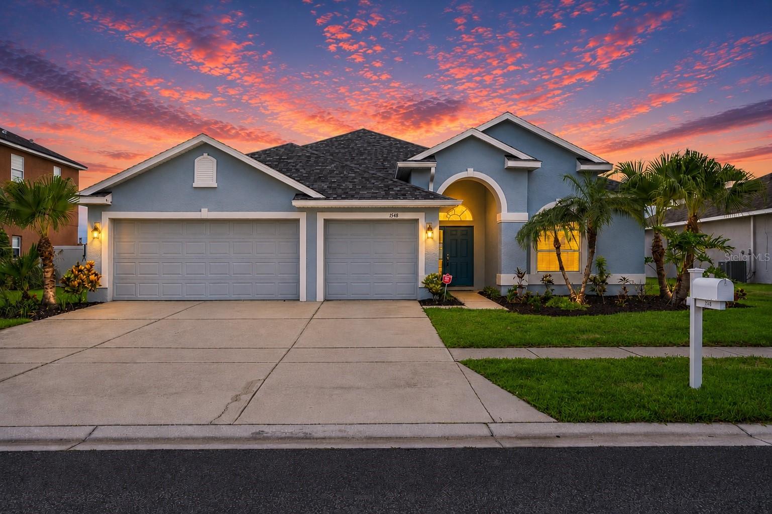 WATERFRONT | NO FRONT OR REAR NEIGHBORS | POOL HOME | 3-CAR GARAGE | GATED COMMUNITY | LOW HOA & CDD. This is truly a home that inspires, with stunning sunset views unfolding in your own backyard. Situated on a premium lakefront lot with no front or rear neighbors, this spacious 4-bedroom + Office, 3-bath home offers over 2,513 square feet of comfortable living space with stunning water views. The mature landscaping and covered front porch create impressive curb appeal from the moment you arrive. Inside, you'll find an open and functional floor plan designed for both everyday living and entertaining. The kitchen serves as the heart of the home with abundant cabinetry, solid-surface countertops, stainless steel appliances. The spacious family room flows seamlessly from the kitchen, creating the perfect gathering space for family and friends. Features include a main-floor primary suite, and generous living areas throughout. The oversized owner's suite offers peaceful waterfront views and an UPDATED ensuite bath, while three additional bedrooms and two additional full baths provide flexibility for family, guests, or a home office. Step outside to enjoy serene lake views from your backyard and experience the privacy that comes with having no rear neighbors. Fresh exterior paint completed within the last two years adds additional peace of mind. Low quarterly HOA includes access to the community pool, tennis courts, playground, park, and gated entry. Conveniently located near shopping, dining, schools, and just minutes from E.G. Simmons Conservation Park and waterfront dining. UPDATES: NEW ROOF 2024 | NEW HVAC 2023 | NEW TILE FLOORING 2024 | NEW CARPET 2024 | NEW POOL 2024 | PATIO EXTENSION 2025 | UPDATED PRIMARY BATH 2023 | HURRICANE WINDOWS/DOORS in back of home 2024 | FENCING 2024 | GUTTERS 2025 | HOA $234/Qtr