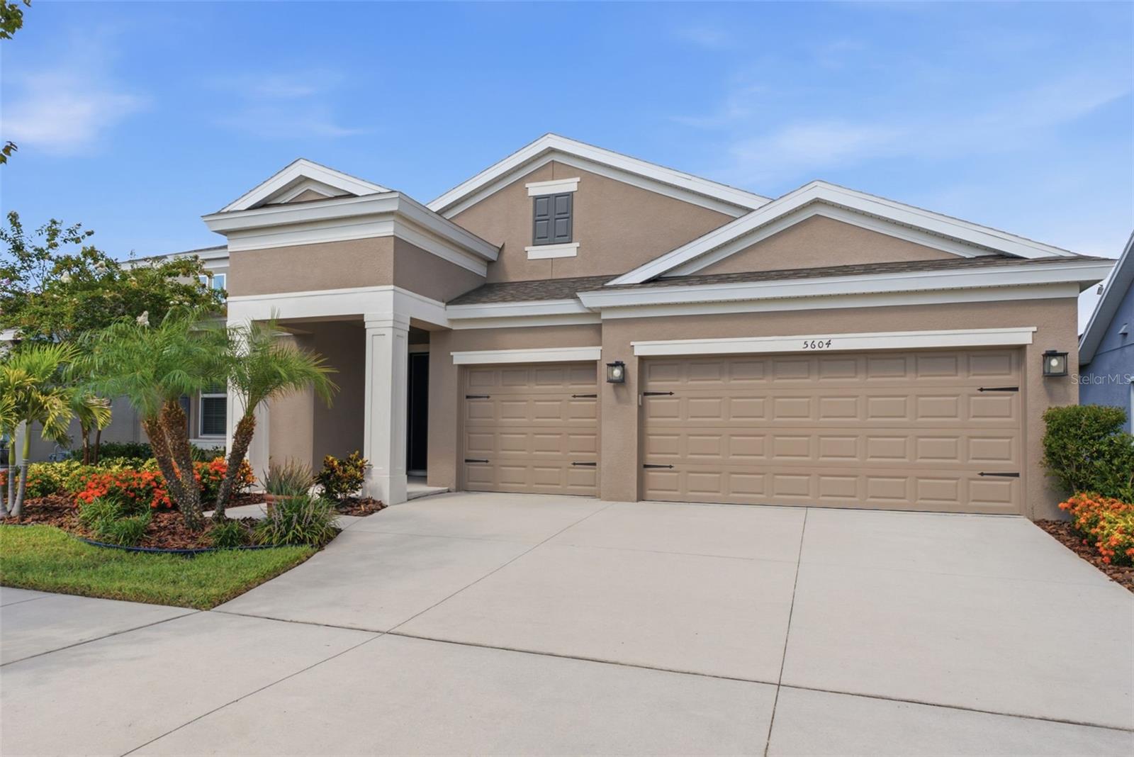 Honey- STOP THE CAR- this beautifully maintained WestBay Bayshore I delivers 4 bedrooms, 3 bathrooms, and a 3-car garage. This WestBay's most desirable split-bedroom floor plan, and it offers the space and flexibility today's buyers are searching for.

Located in a newer section of Waterset, just a short walk from the community amenity center and close to highly rated schools, the home was thoughtfully upgraded during construction with features that enhance everyday living. Natural light fills the open living spaces, while custom motorized shades provide effortless control of privacy and sunshine throughout the day.

At the heart of the home, the expanded kitchen offers generous prep space, an oversized island, and an easy flow into the dining and family rooms—perfect for everything from weeknight dinners to holiday gatherings. The enlarged laundry room adds the kind of practical workspace and storage that buyers rarely realize they need until they have it.

Out back, the extended covered lanai and fully fenced yard create an inviting outdoor retreat where you can enjoy morning coffee overlooking the pond, host friends for weekend cookouts, or simply unwind at the end of the day.

Beyond your front door, Waterset continues to stand apart with resort-style pools, fitness centers, miles of walking and biking trails, playgrounds, dog parks, sports courts, and a full calendar of community events. Everyday conveniences, shopping, dining, and highly rated schools are all nearby, with easy access to I-75, US-41, MacDill Air Force Base, downtown Tampa, Tampa International Airport, St. Petersburg, Sarasota, and the Gulf Coast's renowned beaches. Apollo Beach's marinas, waterfront restaurants, and spectacular sunsets are just minutes away.
Schedule your private showing and see firsthand what makes this home stand out.