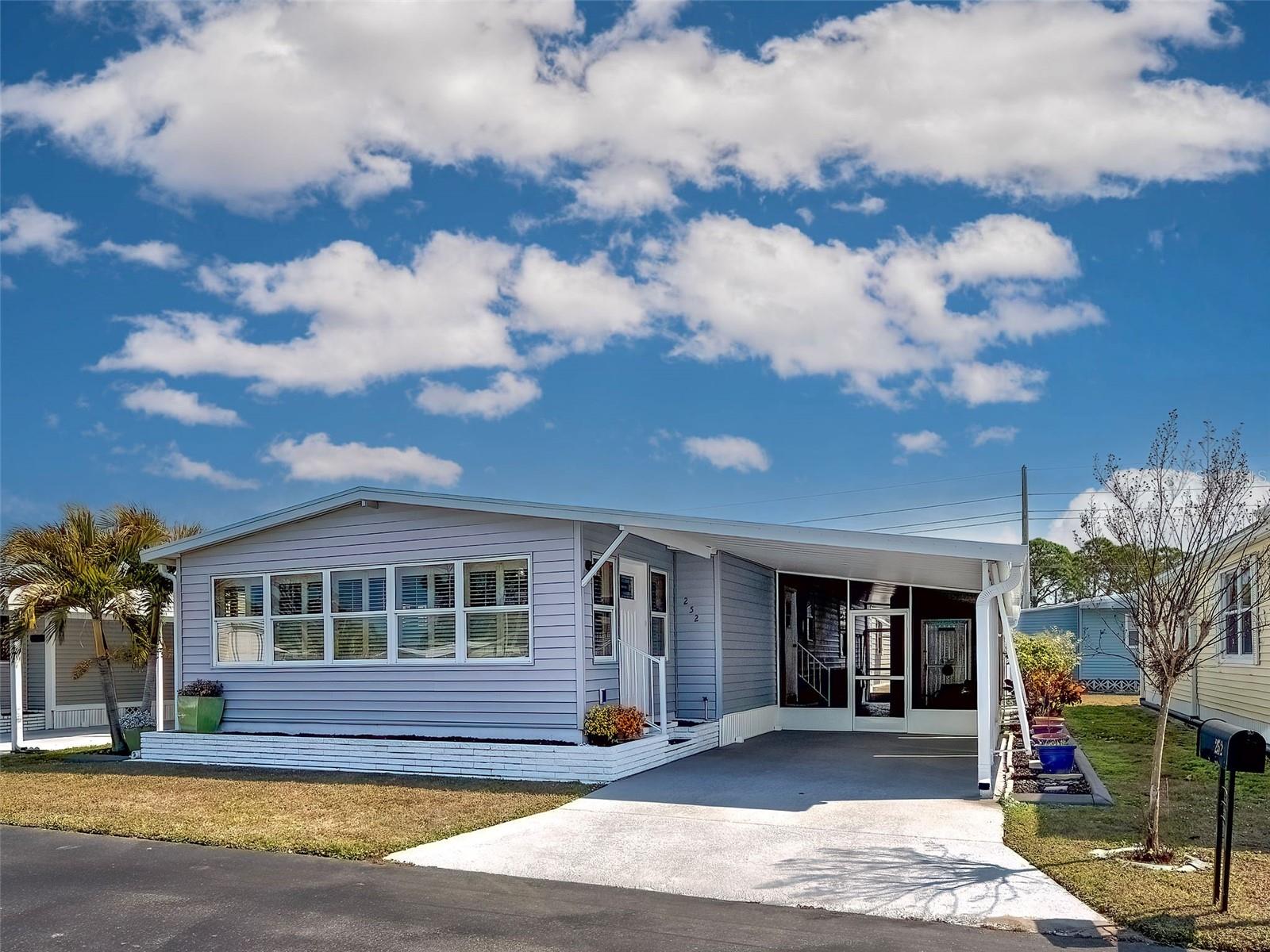 Welcome to easy Florida living in The Arbors of Osprey! This beautifully updated 2-bedroom, 2-bath manufactured home offers modern finishes, thoughtful upgrades, and a spacious open layout designed for comfort and entertaining. Step inside to discover newer tile and laminate flooring flowing throughout the home. The remodeled kitchen is a true showstopper, featuring raised-panel cabinetry, quartz countertops, a striking stone backsplash, center island, pantry, and plenty of prep and storage space. The open floor plan seamlessly connects the kitchen to the dining area and spacious family room, perfect for gatherings or relaxed everyday living. The spacious primary suite offers a walk-in closet and an updated ensuite bath complete with dual sinks in a new vanity, newer lighting and mirror, and a walk-in shower. The guest bedroom is versatile and inviting with a convenient Murphy bed, while the second bath has been tastefully updated with a tub/shower combination, new vanity lighting, and mirror. Enjoy Florida’s sunshine year-round in the bright Florida room filled with loads of windows, or unwind on the screened, enclosed lanai. Plantation shutters throughout the home. Additional highlights include a utility shed with washer and dryer, non-skid surface in lanai and driveway.  Major system updates for peace of mind include a 6-year-old roof with transferable warranty, newer A/C, tankless hot water heater, 98% plywood subflooring, and cement board subfloor in the kitchen and dining room. Located in the desirable Arbors community in Osprey, this home is part of an active, friendly neighborhood featuring a clubhouse, swimming pool, shuffleboard courts, outdoor fitness area and a full calendar of social activities. Ideally situated between Sarasota and Venice, you’ll have easy access to boutique stye shopping, multiple dining options, theaters, performing arts venues, and stunning Gulf beaches. Everything you love about the Florida lifestyle just minutes away. This is relaxed, low-maintenance living in a welcoming community. This fully furnished, move-in ready home blends quality upgrades with relaxed Florida charm. Schedule your private showing today and start enjoying the lifestyle you deserve!