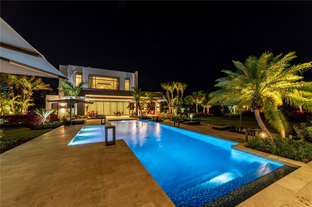 An exclusive offering at The Legacy awaits. Live luxuriously with an abundance of privacy and convenience at this vibrant new construction Dorado Beach home. It consists of the primary and detached entertainment building with 7,632 and 5,000 square feet. Built-in 2021 with high-end finishes and true quality craftsmanship can be throughout the home, this space is truly move-in ready. Hand-selected tile flooring, natural light, and elegant fixtures fill the open-concept entertaining spaces and private rooms, creating an elevated living experience. Your inner home chef will delight in taking advantage of the expansive kitchen designed with solid wood-style cabinets, spacious countertops, and a beautiful backsplash with views of the patio just beyond the kitchen from the sliding glass doors. The Legacy additionally offers a private bar area within the home with a custom-crafted Samsung TV -the first of its kind on all of the island. The adjoining living room provides a lovely backdrop for hosting loved ones as you enjoy time spent creating new memories and sharing laughter after a home-cooked meal with a bar and access to the patio through sliding glass doors.

Entertain outdoors in the sprawling surrounding oasis with functional and intricate landscaping that compliments the natural surroundings, including the patio with patio set and views of the luxury pool and cabanas. This lovely spot provides the perfect amount of shade combined with a subtle breeze to enjoy any warm PuertoRican day spent reading your favorite book, enjoying a meal al-fresco, or simply taking in the surrounding natural beauty. The owner's suite exudes a tranquil feeling with light and airy coloring, floor-to-ceiling windows overlooking the landscape, a deep closet, and an updated spa-like attached ensuite with many custom finishes. Work from home? The property provides work-from-home space secluded from the rest, allowing for privacy during zoom calls or other business meetings.

The surrounding neighborhood is one of Puerto Rico's most refined. Dorado boasts world-renowned beaches such as Balneario de Dorado and Playa De Sardinera, with beautiful beaches and stunning views of the turquoise waters. Spend your free time golfing at the Dorado Beach East Golf Course, shopping, or dining at some favorite local restaurants with traditional food. Noteworthy features of the property include access to building amenities such as a basement gym, elevators, a resort-style pool, and many other high-end facilities and events. This home is truly a once-in-a-lifetime opportunity to join the already sold-out community. All that's left for you is to pack your bags and start your next great adventure on Dorado Beach!