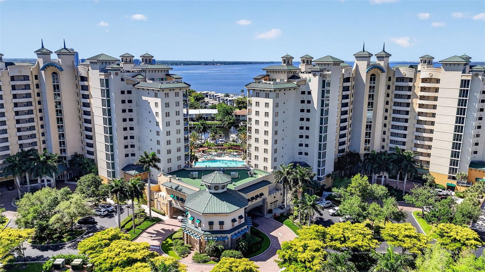 Elevated waterfront living meets refined versatility in this stunning 5th-floor TURNKEY residence at North Star Yacht Club. Showcasing breathtaking views of the Caloosahatchee River, Downtown Fort Myers skyline, and the marina below, this residence offers a front-row seat to Southwest Florida’s most sought-after waterfront lifestyle. Originally designed as a 3-bedroom, this home has been thoughtfully reimagined to enhance both elegance and functionality. The third bedroom has been transformed into a sophisticated dining space with water views, creating an open, upscale entertaining experience—while still offering the ability to easily convert back to a 3-bedroom layout if desired. The guest suite is designed as a true flex space, featuring a built-in Murphy bed seamlessly integrated into the design, allowing the room to effortlessly transition between a private office and a comfortable second bedroom without compromise. Expansive floor-to-ceiling glass fills the living space with natural light, while capturing stunning daily views of boats passing through the marina and the ever-changing riverfront scenery. The primary suite offers a peaceful retreat with water views as soon as you lift your head from your pillow, complemented by a spacious layout and refined finishes throughout. Residents enjoy access to resort-style amenities, including a 15,000 sq ft clubhouse, lagoon-style pool and spa, fitness center, tennis and pickleball courts, and a private marina with direct Gulf access—all within a gated waterfront community just minutes from Downtown Fort Myers. A rare opportunity to own a flexible, design-forward waterfront residence where luxury, views, and lifestyle align.