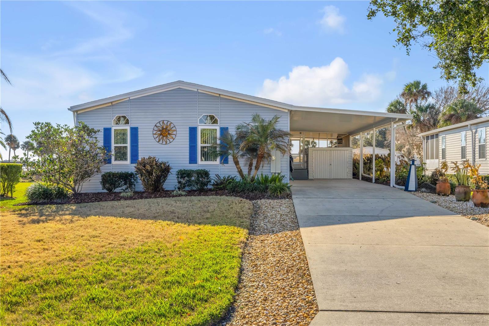 It is about Location and the View !!!! You cant miss this one !!  It comes FURNISHED!! Just move in. Located in the gated community of Light House Cove. This home has two bedrooms, two bathrooms with den that can be used as a 3rd bedroom.  It also has a screened porch, inside utility room, sprinkler system, washer, dryer, carport with storage shed.  Enjoy Great river views from your living room or deck.  This property has Florida living written all over it with a community Club House, Large Swimming Pool, Pickle Ball, Shuffle Board Courts, Fishing Pier, Recreational Picnic Area on river and boat ramp for shallow water boats. You can watch the boats go by from the comfort of your living room.  Home is pristine and has been well taken care of with a with new roof, double pane high impact resistant windows, patio door, flooring, water heater, refrigerator and updated kitchen.  The river is just steps away from this home for the an easy launch of your kayaks to explore the back waters.  It is a great place to call home with sunrises, moonrises, rocket launches all close.  Golf Carts are a second means of transportation within this community. The subdivision is active with community events through the year.  Community dock has a boat ramp to launch your boat.  Mosquito Lagoon and its backwaters for some of the best fishing in the World. Head to lunch/dinner to several waterfront establishments within the area.