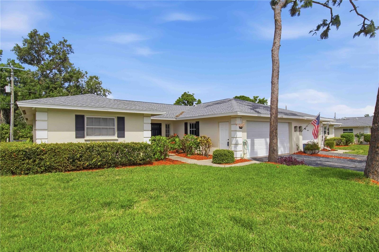 Welcome to easy Florida living in this beautifully updated, maintenance-free two-bedrooms plus den/office, two-bath villa with a two-car garage in the sought-after Palm Aire community. Double entry doors with convenient screens, open to a bright, open interior featuring large, easy-care ceramic tile throughout the main living areas—perfect for both comfortable everyday living and entertaining.
The spacious living room flows into a sunny Florida room with upgraded wood flooring, offering additional versatile living space and easy access to the outdoors. The island kitchen is well-appointed with wood cabinetry and stainless steel appliances, double sink, & pantry.
The primary suite features a generous walk-in closet and a private en-suite bath, while the guest bedroom is thoughtfully positioned for privacy near a full bath. The office is bright & spacious, very suitable for working from home.
Recent updates include a new roof (2023), new air conditioning 2023 with digital thermostat & dehumidifier, and a new hot water heater 2022. Furnishings are negotiable.
The association fee covers exterior and grounds maintenance, as well as sewer, water, trash, and basic cable. Enjoy the community pool just a couple of homes away, and take advantage of nearby Palm Aire Country Club, offering optional golf, pickleball, dining, and social memberships.
Ideally located close to shopping, dining,  UTC, downtown Sarasota, and the area’s renowned beaches.