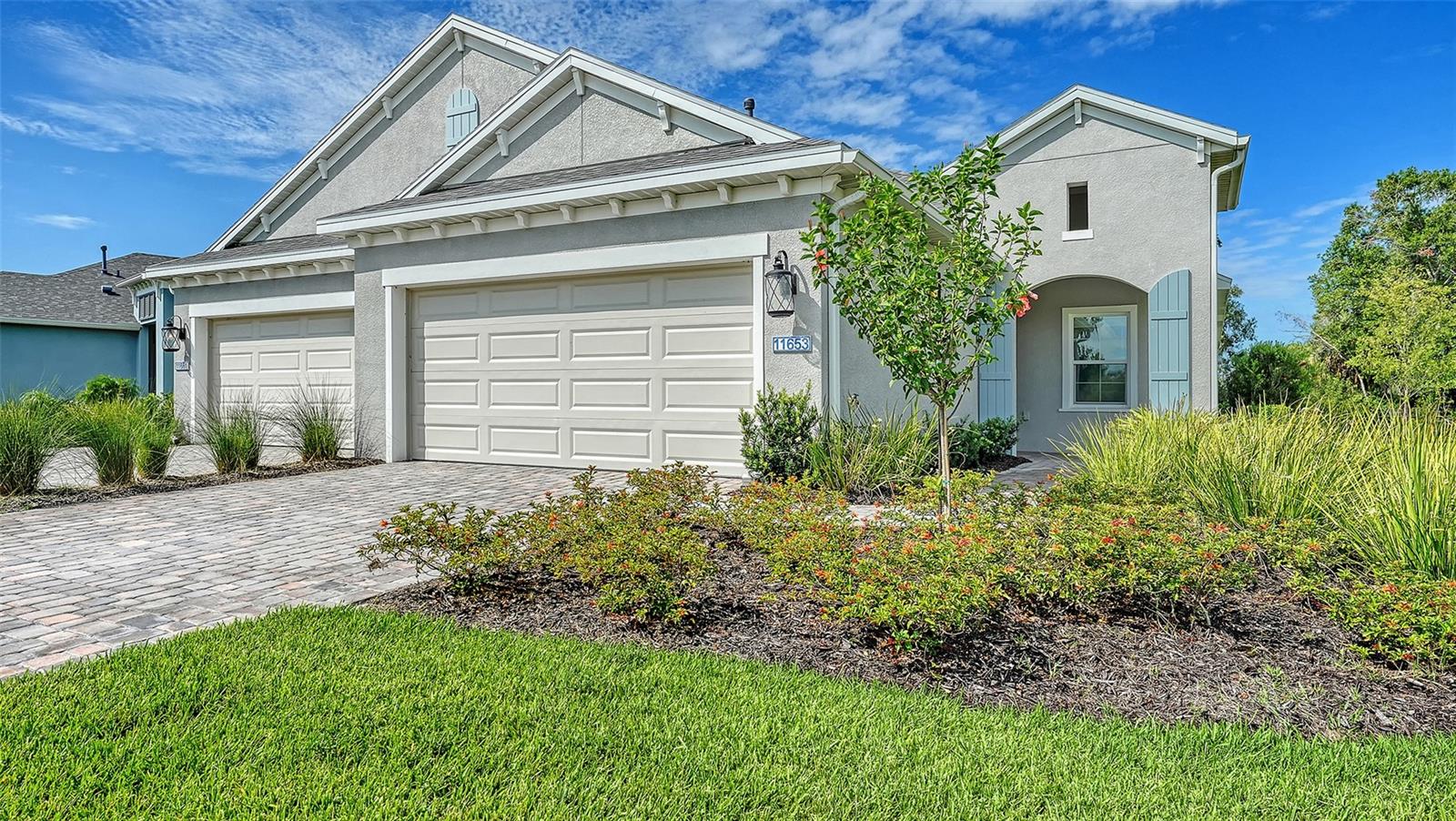 The Tidewater 2 by Neal Communities is a thoughtfully designed twin villa offering 2 bedrooms, 2 bathrooms, and a versatile den. The open-concept layout features a spacious great room that flows seamlessly into the dining area and beautifully appointed kitchen with a large island, making it ideal for everyday living and entertaining. The den provides the perfect space for a home office, hobby room, or flex area. Sliding glass doors lead to the covered lanai, creating a relaxing outdoor retreat. The owner's suite includes a window overlooking the lanai, two walk-in closets, and an en-suite bath with dual vanities, a walk-in shower, and a private water closet.