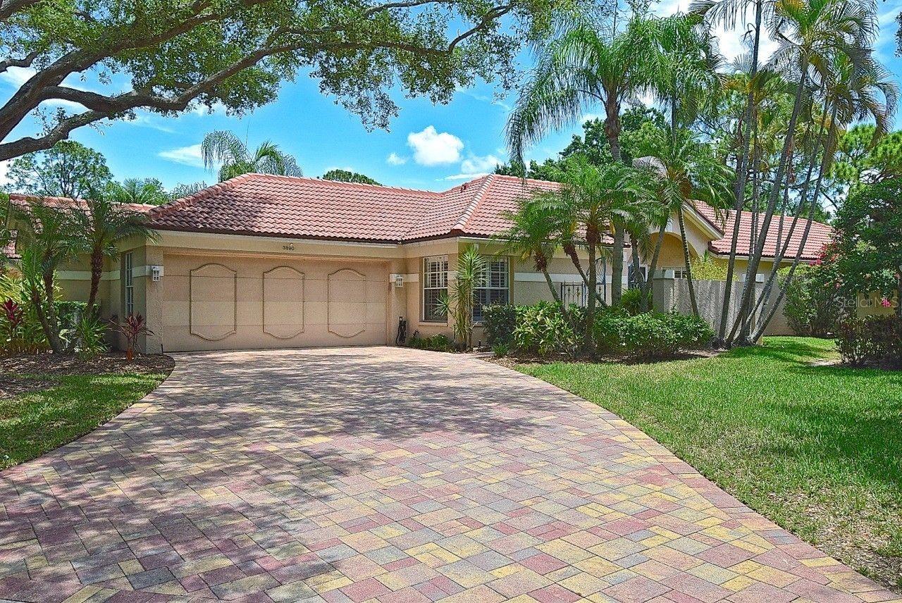 Nestled within the highly desirable enclave of The Meadows, this beautifully maintained residence sits on Lyndhurst Court, an intimate community of just 32 single family homes. Perfectly positioned along the 11th fairway of The Meadows Golf Course, the property offers a rare, unobstructed panoramic view with no homes visible across the fairway, creating a peaceful and private setting that is difficult to find.
A dividing privacy wall between the neighboring home forms a charming garden walkway leading to the screened lanai. The exterior flooring has been fully tiled, softening the look and feel of the outdoor living spaces and making them ideal for relaxing or entertaining.
Inside, the home welcomes you with high vaulted ceilings and an open layout that reveals new architectural angles from every direction. The main living areas are finished with 20" porcelain tile, with matching plank style porcelain tile in the bathrooms for a cohesive, upscale design.
The updated eat in kitchen features beautiful cabinetry, Quartz countertops, stainless appliances, and abundant storage including a pantry/closet. The adjoining living and dining room is filled with natural light and offers generous space for gatherings, all framed by sweeping golf course views. A wood burning fireplace serves as the focal point of the living room, flanked by two arched niches perfect for displaying art or treasured décor.
The primary suite is privately located at the rear of the home, offering a quiet retreat with serene views. The expansive primary bath includes an extra-large 122" double sink vanity, a custom walk-in closet plus two additional closets, a spacious glass enclosed shower illuminated by a skylight, and a separate vanity/sink near the toilet. An exterior door provides direct access to the screened lanai.
The second bedroom has been thoughtfully remodeled into a private guest suite, complete with a walk-in jetted tub, with shower, quartz top vanity, elegant lighting, and a generous walk-in closet.
The third bedroom has been transformed into an oversized den/office/TV room, with the closet removed to maximize space. Wall mounted TVs in the bedrooms will remain with the home. Oversized 2 car Garage with extra work/storage room.
This residence is a "must see" and combines privacy, thoughtful updates, and a premier golf course setting within one of Sarasota’s most sought-after communities.
The Lyndhurst HOA and The Meadow Community Association {MCA documents are available through each Association’s website}.

Community Amenities Include: golf, tennis, pickle ball, fitness, walking trails, club and community pools