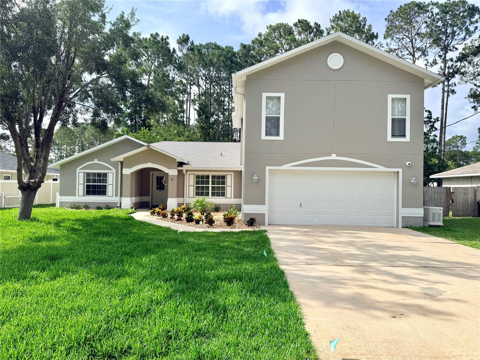 Spacious and versatile 5-bedroom, 3-bath home in Palm Coast with room for everyone and everything! Recent updates include a new roof and HVAC in 2023, fresh exterior paint, new sod, and professional landscaping. Inside, you'll find luxury vinyl plank flooring and ceramic tile throughout, meaning there's not a stitch of carpet to worry about. The thoughtfully designed floor plan features oversized rooms, abundant closet space, and two primary suites, one upstairs and one downstairs, offering flexibility for multi-generational living, guests, or a private home office. The kitchen is a cook's delight with extensive cabinet storage and generous countertop space. Enjoy Florida living from the rear screened porch overlooking the fenced backyard, and appreciate the freedom of having no HOA. The oversized attached two-car garage provides even more storage and functionality. A whole-house generator and propane tank are available and will convey with the property for an additional $13,000. Otherwise, they will be removed prior to closing. The property is currently operating as a sober living residence. Occupants do not have leases and will be relocated prior to closing.
