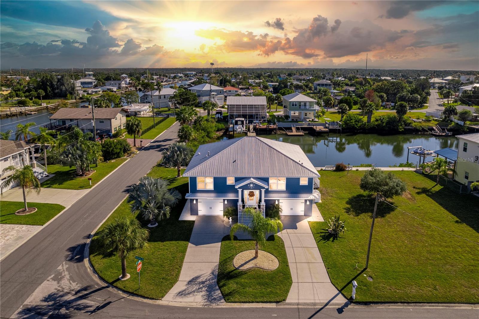 CHANGE YOUR LIFESTYLE AT THE SEAHORSE HOUSE A Waterfront Gem in Quaint Hernando Beach! Welcome to The Seahorse House, where coastal charm meets modern comfort! This Beautiful Waterfront Home is perfectly situated on a corner lot offering quick, direct access to the Open Gulf — no fixed bridges, no long canal rides, just instant adventure! The iconic Seahorse mailbox sets the tone for the coastal lifestyle you've been dreaming of. Step inside the elegant foyer and you'll immediately appreciate the open floor plan, designed to maximize natural light and those incredible water views. The living room, dining room, and family/game room flow seamlessly, offering plenty of space for entertaining or relaxing after a day on the water. The Chef's Kitchen is a Showstopper — featuring a Commercial-Grade Gas Stove, Gorgeous Marble Counters, a large Island/Breakfast Bar, and ample storage including two built-in pantries with pull-out drawers and an additional closet pantry. The dining room overlooks the waterfront, creating the perfect setting for Dinners or Weekend Brunches. Upstairs, step out to the Upper Porch, an entertainer's dream with a Summer Kitchen and Granite Bar, Perfect for Grilling and Gathering while taking in the Breezes off the water. Right next to it, the Upper Deck offers a Relaxing Retreat for Morning Coffee, Colorful Sunrises, or even Rocket Launches lighting up the Coastal Sky. The home offers 3 spacious bedrooms, 2.5 bathrooms, a 2-car garage, plus versatile spaces including a family/game room and a dedicated exercise room. Boaters will love the Boat-Flex floating dock with swim ladder, ideal for launching your next Gulf adventure or taking a quick dip. Major upgrades include a 2024 HVAC, 2021 metal roof, and a 2017 seawall for peace of mind and value. 3M Film on the Windows, New Front Doors. Love extra space? The lot next door is also for sale for 250,000 — the perfect opportunity to expand your coastal footprint or keep for privacy. Hernando Beach offers everything you love about Florida's Nature Coast — marinas, waterfront restaurants, gift shops, and a laid-back boating community. Plus, you're just minutes from the famous Weeki Wachee River, where manatees and kayakers share the sparkling waters. The Seahorse House isn't just a home — it's a lifestyle. Come experience coastal living at its finest!