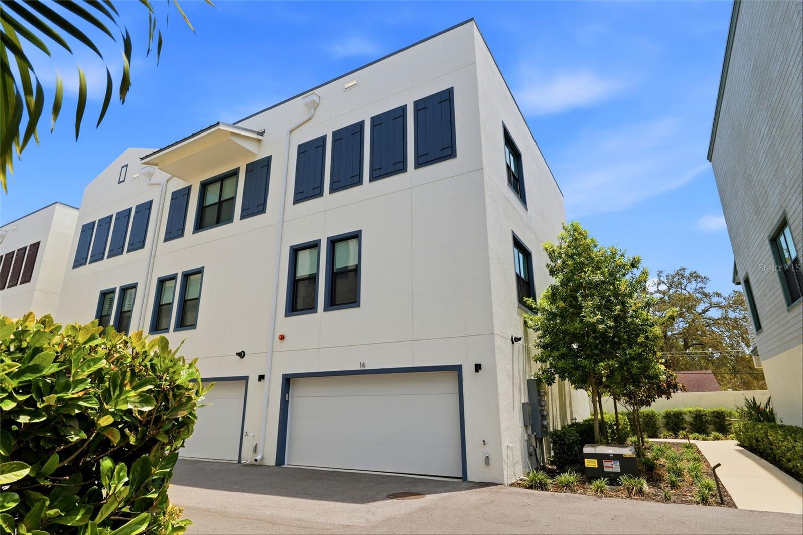 Natural light moves with intention throughout this three-story townhome, where a private elevator connects all levels and a rare dual-exposure design brings brightness and balance to each floor. Private balconies extend the living experience outdoors, overlooking a dynamic downtown waterfront setting where live music and coastal energy become part of the backdrop. From the front-facing windows, views overlook a gazebo, cascading waterfall, and thoughtfully designed landscaping... adding a sense of calm and visual interest. 

Set within Gramercy Court, the residence is thoughtfully positioned near parking and community gathering spaces, offering a seamless blend of accessibility and privacy. Interiors reflect a refined, cohesive aesthetic. Walls finished in Sherwin-Williams “Ice Cube” are paired with vinyl plank flooring in “Chatter Oak,” creating a calm, neutral foundation throughout, complemented by 8-foot solid wood doors, tailored millwork, and a discreetly integrated office nook. Remote-controlled blinds and ceiling fans are installed throughout every room, while a Nest thermostat provides streamlined climate control.

The kitchen is designed with both precision and presence... gray shaker cabinetry, quartz countertops in “Dove Beach,” and a full-height subway tile installation are paired with a professional-grade appliance suite, including Sub-Zero refrigeration, a Wolf gas range with hood and microwave, and a Cove dishwasher. A walk-in pantry adds further functionality without compromising design.

Three bedrooms and 3.5 bathrooms continue the home’s elevated material palette, featuring granite countertops, brushed nickel fixtures, and glass shower enclosures. The primary suite offers a spacious walk-in closet and a dual-sink vanity designed for everyday ease.

A whole-home water softener, an instant tankless water heater and laundry on the same floor as the primary makes life simpler. The garage is finished with durable epoxy flooring, includes two walk in storage closets, and is equipped with an electric vehicle charging station.

In just a few steps, you’re in the heart of Downtown Dunedin, home to vibrant weekly markets, seasonal festivals, and community parades, the area also features live music, local gatherings, and a strong sense of connection providing a lively yet well-balanced ambiance where you can enjoy the energy from a comfortable distance. 

Enjoy award-winning restaurants and craft breweries, scenic waterfront parks, a full-service marina, and convenient access to the Pinellas Trail. A golf-cart-friendly setting where everything is close and the energy is always coastal and connected… with three gorgeous beaches just minutes away. This is Dunedin living at its finest.

A composed and well-executed residence offering low-maintenance living with a level of finish and design rarely found in townhome communities.  See... Fall in Love... Make it Your Own!!!
