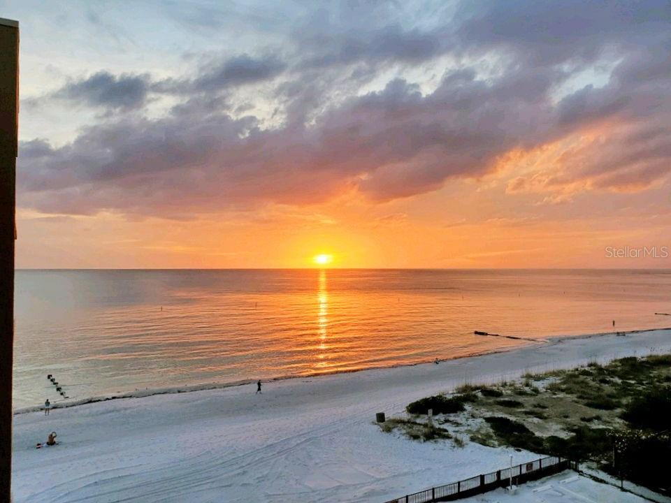Welcome to paradise! Enjoy sunsets and coastal breezes!  This beautifully updated 2-bedroom, 2-bathroom condo is perfectly positioned on the Gulf of Mexico in the heart of Madeira Beach. Enjoy direct access to pristine white sandy beaches, or take a short stroll to the Intracoastal Waterway, local favorites like Daiquiri Shak, sushi spots, rooftop lounges, tiki bars, and vibrant shopping and dining.

The community offers a newly renovated (2026) resort-style pool and spa, complete with an outdoor shower—perfect after a day at the beach. Secure building and pool access, beach access as well as 1 assigned parking spot + plenty of guest spots. Secure Mail/Package area. Exterior of the building freshly painted. Pet friendly. Turn-key and ready for move in! Perfect for a primary residence, seasonal owners, or investment.

Inside, the light and bright kitchen was fully renovated in 2019 and features quartz countertops, white cabinetry, pantry with pull-out drawers, recessed and under-cabinet LED lighting, and stainless appliances including a new refrigerator (2025). The open-concept layout seamlessly connects the kitchen, dining, and living areas, creating an ideal space for entertaining.

Additional upgrades include a new A/C (2020), hurricane shutters with remote-controlled motors (updated 2023/2025), and ceramic tile flooring throughout. Both bedrooms offer walk-in closets, with updated tile flooring in the primary (2022) and guest (2018). The primary en-suite bath features a private layout with glass block accents, comfort-height vanity, and updated fixtures, while the guest bath has been refreshed with a new vanity, sink, and valves. Washer/Dryer in the unit.  All appliances convey.  

Bring your flip flops! Relax and unwind on the spacious screened lanai with removable panels, perfect for enjoying coastal breezes year-round. Whether you're looking for a full-time residence, vacation getaway, or investment opportunity, this condo delivers the ultimate Florida lifestyle.