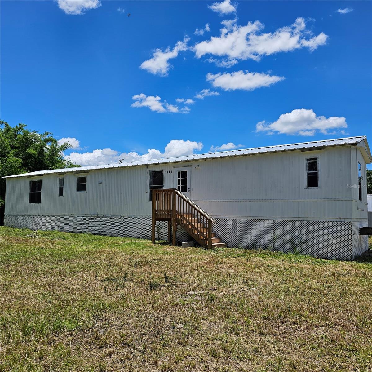 3 bedroom 2 bath on double  lot partially fenced needs some tlc, does have new kitchen, new bathroom, new metal roof, new ac and new well equipment. Come take a look see if its for you.
