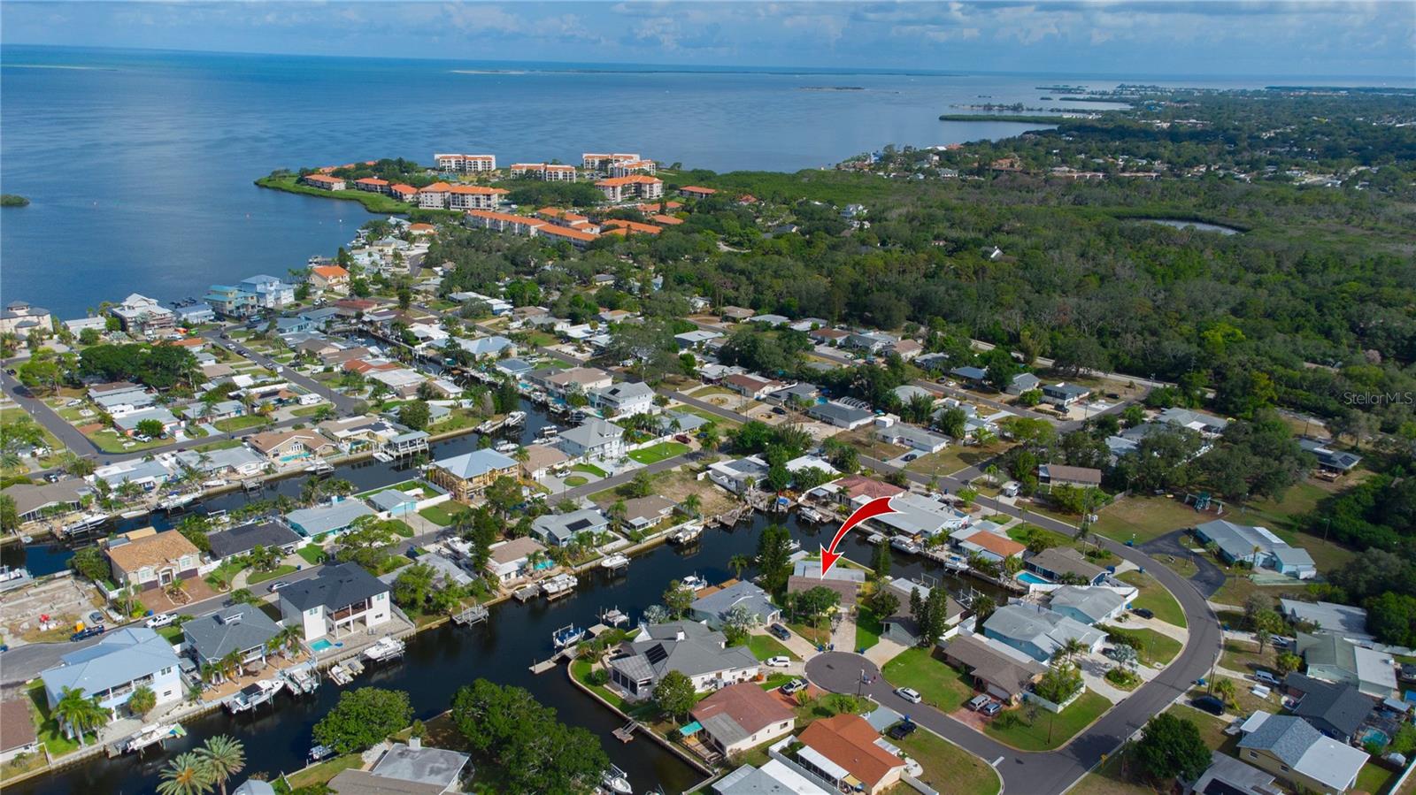 Experience the ultimate Florida waterfront lifestyle in this beautifully renovated coastal retreat, perfectly situated on an oversized pie-shaped lot at the end of a quiet private cul-de-sac. Boasting more than 155 feet of waterfront, this exceptional property offers direct Gulf access and is a dream come true for boaters, anglers, and anyone who loves life on the water. Step outside to your private backyard paradise featuring a brand-new oversized composite dock complete with a 15,000lb boat lift, making it effortless to launch your next adventure. A new seawall cap provides added peace of mind, while the expansive waterfront offers plenty of room to relax, entertain, and soak in the coastal scenery. Inside, this home has been completely transformed with quality updates throughout. Major improvements include new roof (2022), new HVAC system and ductwork (2023), double-pane PVC windows and sliding glass doors, luxury vinyl plank flooring throughout, fresh interior paint, a newer paver driveway, a stunning new kitchen, and beautifully updated bathroom vanities.  Don't let the front fool you, this home is remarkably spacious inside. The bright, open floor plan is filled with natural light thanks to walls of sliding glass doors that seamlessly connect the living area to the expansive wraparound screened porch, creating the perfect space for year-round indoor-outdoor entertaining. The thoughtfully designed split-bedroom layout provides privacy for family and guests. The oversized primary bedroom serves as a peaceful retreat, featuring a custom walk-in closet and a beautifully appointed en-suite bath with dual vanities.  The heart of the home is the open-concept kitchen, complete with granite countertops, a center island, abundant cabinetry, and a layout designed for gathering with family and friends.  Location is everything, and this home truly has it all. Enjoy direct Gulf access for boating, fishing and diving enthusiasts. You're also less than an hour from two major airports, making travel convenient for full-time residents and seasonal homeowners alike.  Surrounded by some of Pinellas County's most desirable destinations, you'll be just minutes from the historic Tarpon Springs Sponge Docks, vibrant downtown Dunedin, Palm Harbor, Ozona, Crystal Beach, Honeymoon Island, Caladesi Island, and countless waterfront restaurants, parks, beaches, and shopping destinations. Every nearby community offers its own unique charm and coastal character.  The neighborhood enhances the lifestyle even further with a private community boat ramp and direct access to the Pinellas Trail, perfect for biking, walking, and enjoying Florida's beautiful outdoors.  Whether you're searching for a full-time waterfront residence, a seasonal escape, or the perfect place to enjoy boating and coastal living, this exceptional property delivers it all.  Florida waterfront living truly doesn't get any better than this.
Boat and trailer may be available for purchase separately and can be negotiated as part of the sale.