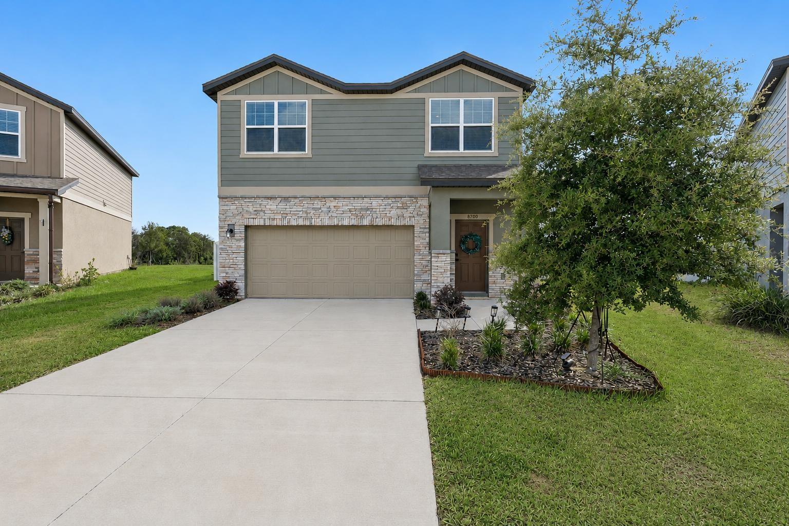 Virtually Staged. Built in 2024, this move-in ready 3-bedroom, 2.5-bath home offers 1,896 square feet of modern living space in Groveland's Phillips Landing community. The open floor plan features spacious living and dining areas, a well-appointed kitchen, and a private primary suite. Situated on an oversized, fully fenced homesite of nearly a quarter acre, the backyard provides ample room for entertaining, pets, play, gardening, or a future pool. Conveniently located near US-27, shopping, dining, parks, and schools. Enjoy the benefits of newer construction with modern finishes, energy-efficient features, and low-maintenance living. A rare opportunity to own a newer home with exceptional outdoor space.
