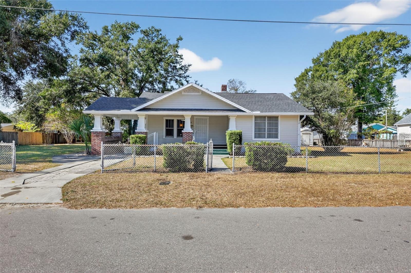 This 1928 Seminole Heights bungalow brimming with character and opportunity. Located in the heart of the Seminole Heights Historic District, one block from the Garden Center, this 3-bedroom, 1-bath home sits on a 51' x 125' lot and offers the architectural details buyers love: original hardwood floors, original wood windows, a wood-burning fireplace, and a welcoming front porch that captures the timeless charm of Tampa's most sought-after historic neighborhood. The home features approximately 1,667 square feet of living space and presents an excellent opportunity for restoration, renovation, or customization. The new roof (replaced November 2025) provides a strong head start, while the existing layout offers potential for reconfiguration, including the opportunity to create a spacious primary suite with an en-suite bathroom. Location is everything, and this property delivers. Situated just one block from the Seminole Heights Garden Center and within walking distance to neighborhood favorites including Starbucks, DI Coffee Bar, Front Porch & Bart's Tavern, and The Salty Donut, you'll enjoy the best of the Heights lifestyle right outside your door. Whether you're an investor, preservation enthusiast, or homeowner looking to create your dream historic bungalow, this is a rare opportunity to acquire a property with authentic character, solid fundamentals, and tremendous upside in one of Tampa's most desirable historic neighborhoods.