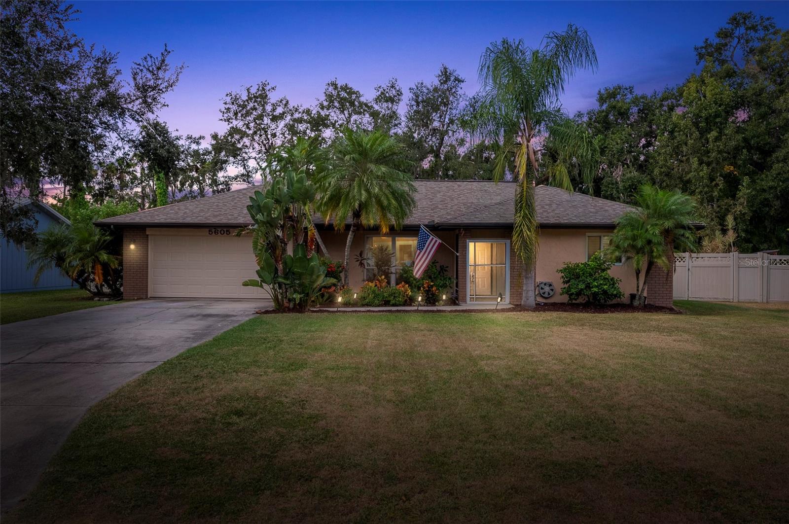 No HOA or CDD Fees! Oversized lots. Incredible, well-rounded, multi-generational neighborhood. No Rear Neighbors – this incredible property has room for a pool, mother-in-law suite, RV parking, you name it. The oversized screened-in back patio with ceiling fans and TVs overlooks incredible mature Pine and Oak trees, set the perfect distance away to enjoy but not so close you'd worry about them falling on the house. It's a perfect place to hang out after a long day. All major improvements are done, including a newer roof (2021), AC unit (2019), and water heater (2018), along with hurricane-rated impact windows and patio doors for added peace of mind.

Located in the Woodlawn community, this property sits in the far corner, giving you an extra level of peace and quiet. This Florida home was built extremely well, with the foundation and exterior in block. The newly painted 2-car garage and carport give you plenty of space for up to 4 cars, with additional street parking. The home has a modern Southern touch and a very popular split floor plan—a stunning 3-bedroom, 2-bathroom layout. The kitchen has soft-close hardwood cabinets and an oversized island with 24-inch cabinets, giving you ample room for every kitchen item you can imagine. The floors were updated to vinyl, and the primary bedroom has its own en suite and walk-in closet, with a brand-new shower just installed in the primary bathroom.

Don't worry about the expensive, challenging items—the owners have already done the heavy lifting for you. This home comes equipped with hurricane-rated impact windows and doors throughout. The two hurricane-impact French doors open up the house and create a flow that entertains and delights. The elegance of vinyl plank flooring runs throughout the main living areas and bedrooms, providing a clean, modern aesthetic with no carpet. This property also includes a handy shed with updated electrical hookups.

Nestled in the charming Woodlawn Lakes neighborhood, you'll appreciate the tree-lined streets and mature greenery. Best of all, you're just a couple of miles from shopping and dining, with easy access to vibrant Tampa, St. Pete, Sarasota, and some of Florida's most beautiful beaches—all within a quick 45-minute drive! Don't miss the chance to make this remarkable home yours. Schedule your viewing today and experience the lifestyle you've been dreaming of!