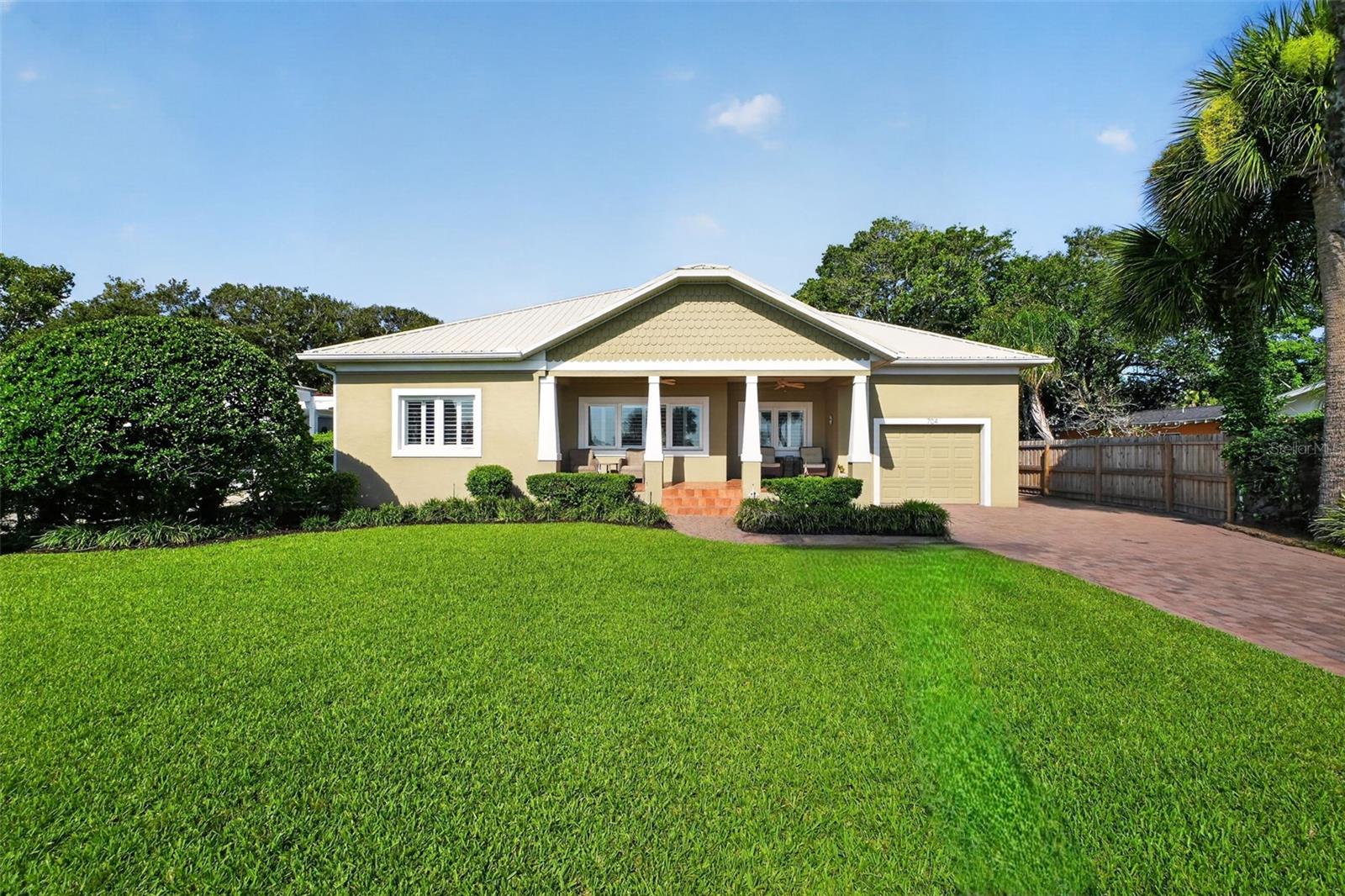 Under contract-accepting backup offers. Welcome to 704 S Beach Street in beautiful Ormond Beach! Situated on a scenic Halifax Riverfront lot, this beautifully renovated Craftsman-style home offers 3 bedrooms, 2 bathrooms, and 2,138 sq. ft. of living space on an oversized 0.41-acre parcel. Renovated down to the studs in 2010, it perfectly blends timeless character with modern updates, including a new metal roof installed in 2024, a new HVAC system in 2026, and a new water heater in 2025. The open-concept floor plan features gorgeous wood floors and a spacious kitchen that flows seamlessly into the living and dining areas, making it ideal for entertaining. Enjoy breathtaking river views and coastal breezes from the inviting front porch, or unwind on the spacious screened-in back patio. An attached one-car garage, detached two-car garage, and ample extra parking provide plenty of room for vehicles, boats, RVs, and guests, while the front porch offers a prime vantage point for Ormond Beach's annual fireworks display.