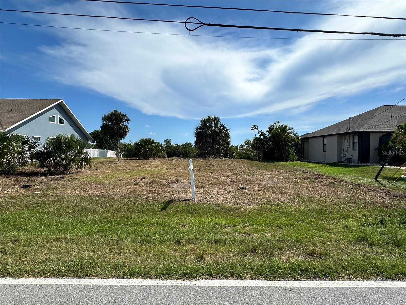 Waterfront canal lot with 80' on the water and access to Charlotte Harbor with no bridges! Enjoy the relaxing view of the Preserve across the canal from this lot that also features a concrete seawall and concrete boat dock. Located just 14 minutes from the Port Charlotte Beach Park where you can put your toes in the sand or soak up the gorgeous sun and fabulous views of the sunset! There is no HOA or deed restrictions in the neighborhood except for county codes and it is conveniently located near shopping and dining.