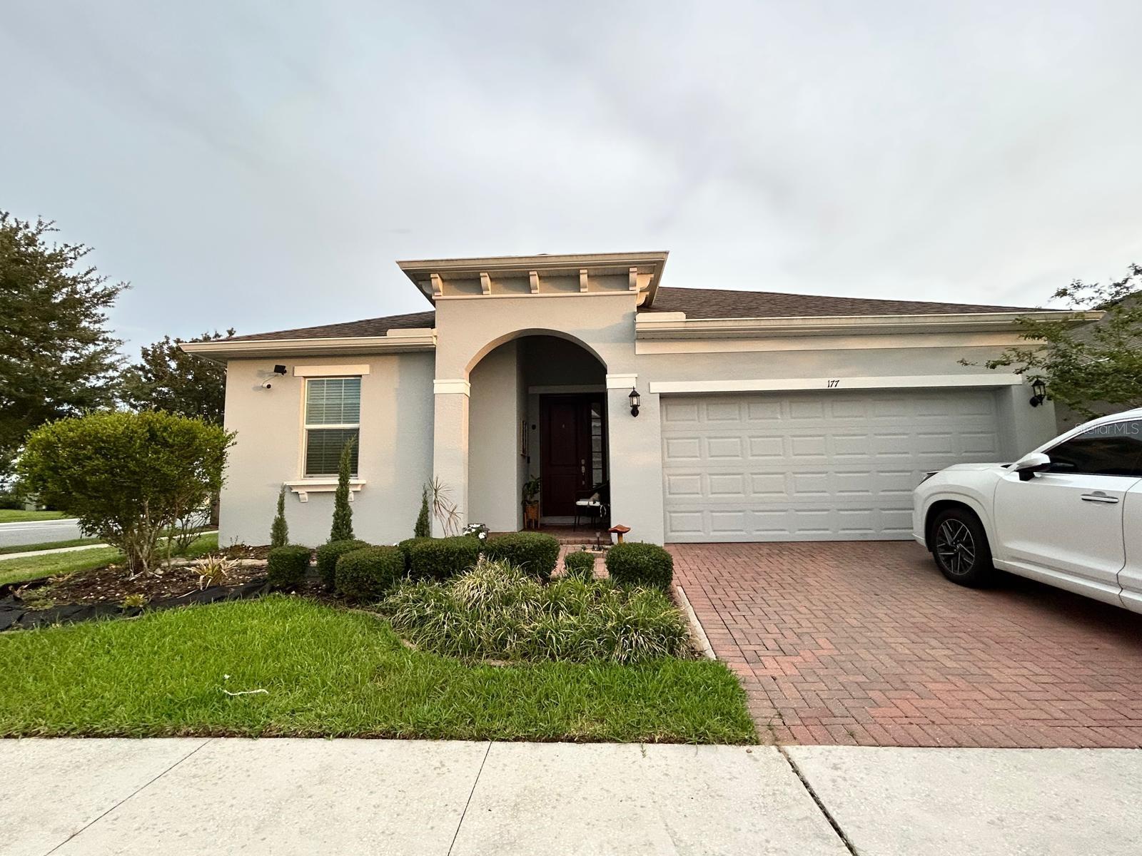 Welcome to this beautiful single-story home located in Trinity Ridge, a peaceful community of just 77 residences. Built in 2019, this corner-lot property offers 3 bedrooms, 2 bathrooms, and a functional, open layout designed for comfortable everyday living.

The home features a spacious, fully fenced backyard with plenty of room for pets, outdoor gatherings, gardening, or recreation. An attractive pergola creates the perfect setting for relaxing, entertaining, and enjoying Florida’s year-round sunshine.

One of the property’s standout advantages is its low monthly HOA fee, offering the benefits of a well-maintained community while keeping ongoing ownership costs affordable.

Conveniently located near US-27, US-192, and Interstate 4, the home provides easy access to Orlando, Walt Disney World, ChampionsGate, Celebration, Tampa, and other popular Central Florida destinations.

Nearby conveniences include schools, grocery stores, restaurants, pharmacies, fitness centers, shopping, golf courses, and essential everyday services. Central Florida’s world-famous attractions and major employment and entertainment areas are also within convenient reach.

With its modern construction, desirable corner location, spacious fenced yard, outdoor living area, low HOA fee, and convenient access to major roadways, this move-in-ready home is a must-see.