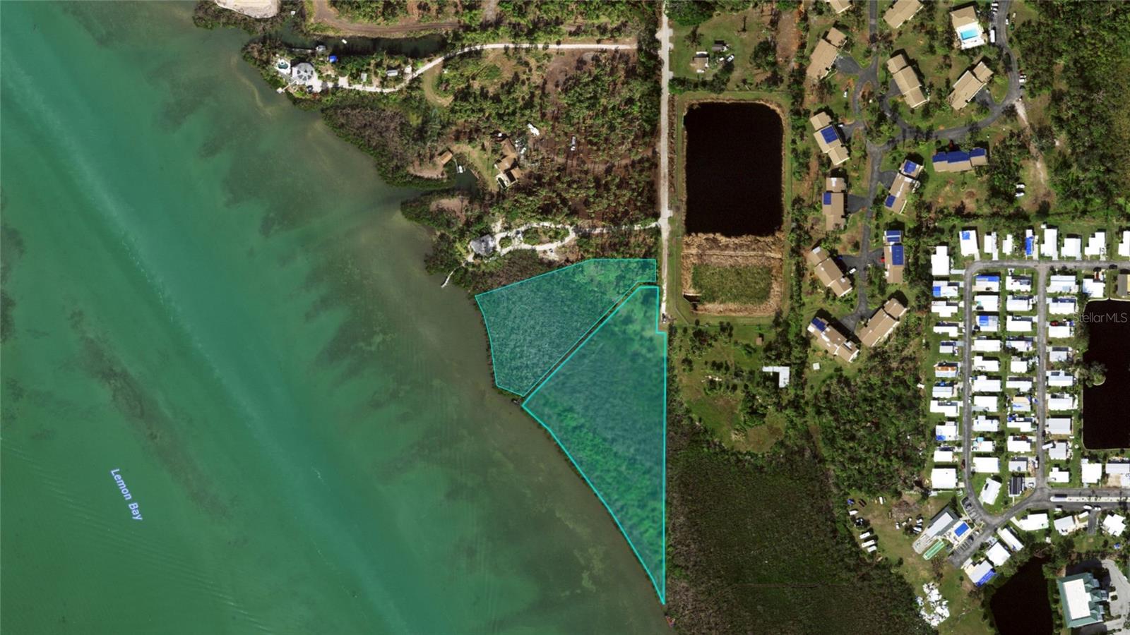 Exceptional opportunity to own two adjoining waterfront parcels totaling approximately 4.49 acres along the shores of Lemon Bay. Offering nearly 800 feet of private bay frontage, this rare property provides breathtaking water views and a unique setting to create a private coastal estate. 

The combined parcels offer a generous upland building area suitable for a custom home while preserving the surrounding natural landscape. A boardwalk path leads through native vegetation toward a shoreline dock, where panoramic views of Lemon Bay create an unforgettable backdrop for sunset watching, boating, fishing, kayaking, and enjoying Southwest Florida’s natural beauty. The

Located near Stump Pass and the Intracoastal Waterway, this property offers convenient boating access while still being just minutes from Englewood Beach, Boca Grande, restaurants, shopping, and golf courses. The setting is private and serene, yet close to everything that makes the Englewood area a sought-after destination.

Whether you envision building a private waterfront retreat, a family compound, or exploring development possibilities (subject to local approvals), opportunities with this amount of acreage and shoreline frontage in Englewood are extremely rare.

Secure your own piece of Lemon Bay waterfront and bring your vision of Florida coastal living to life.