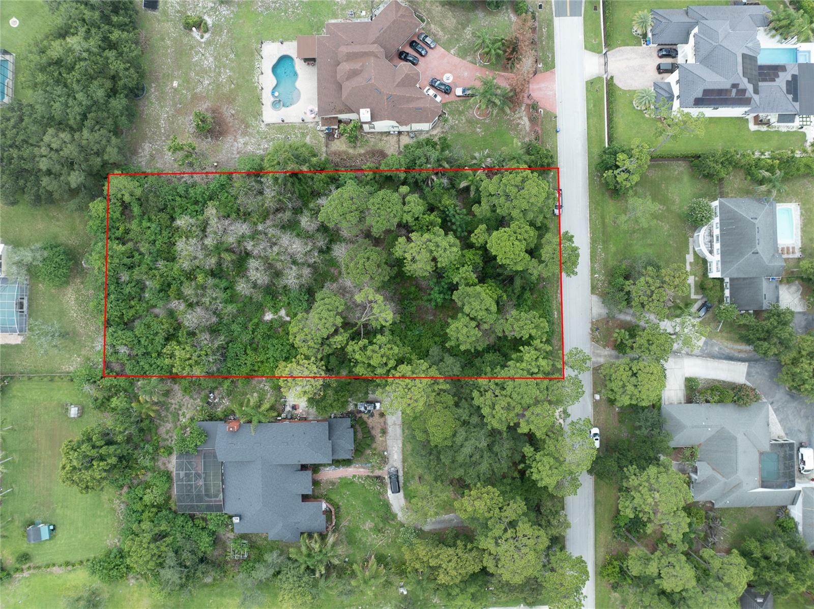 WELCOME TO WINDERMERE HEIGHTS!  Build your dream home on this exceptional 0.93-acre buildable homesite in the desirable Dr. Phillips area of Central Florida. This spacious lot offers the perfect blend of privacy and convenience, with ample room for a custom residence, pool, outdoor living spaces, and more. Ideally located just minutes from world-renowned attractions, the Butler Chain of Lakes, premier shopping, dining, championship golf at Bay Hill, major highways, and top-rated schools. Whether you're looking to build your forever home or invest in one of Central Florida's most sought-after locations, this nearly one-acre ... high and dry ... parcel is a rare find especially with NO HOA! Bring your vision and make it a reality!
