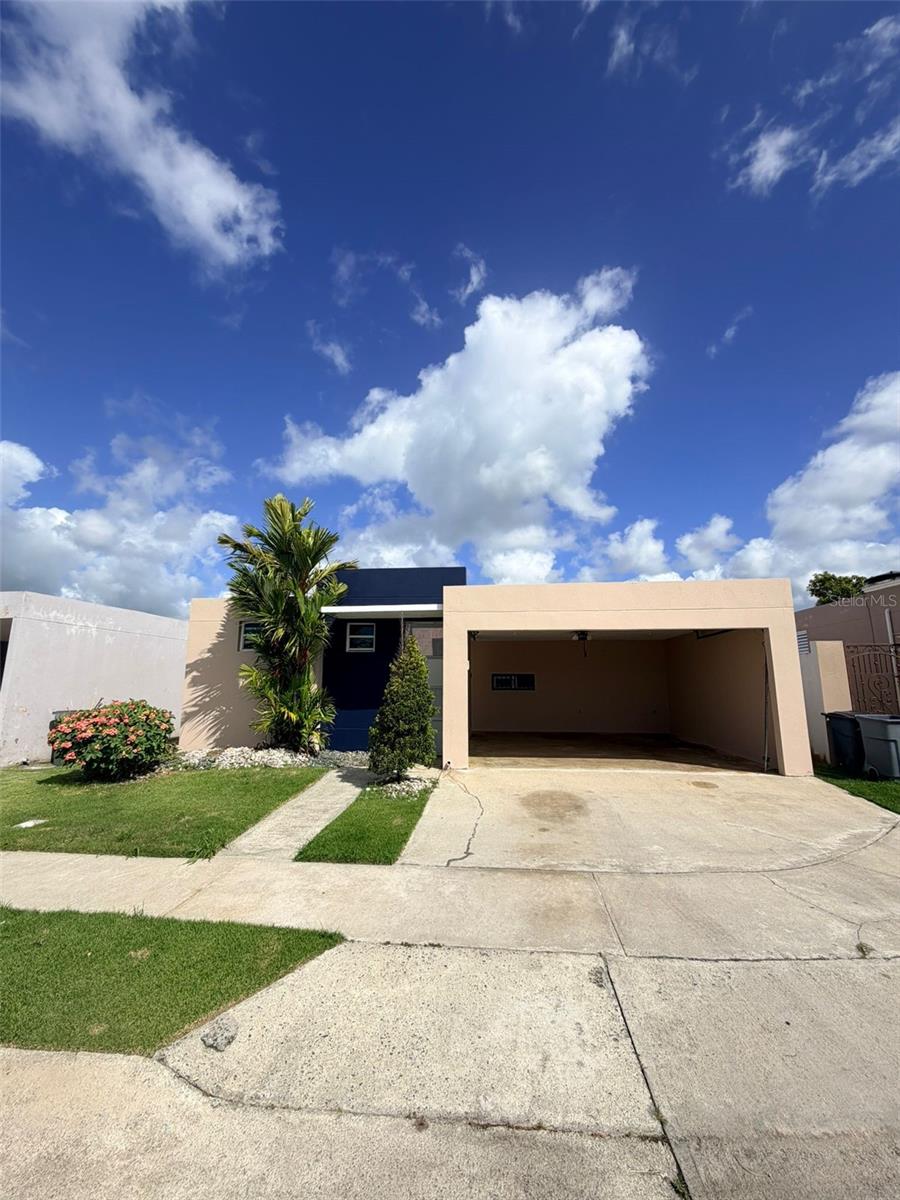 Located in Urbanización Palma Royale in Las Piedras, this single-story residence offers a practical layout in a gated residential community with a 24-hour security gate, basketball court, community area, and playground.

The home features a two-car garage, tiled interior floors, living and dining area, kitchen with wood cabinetry, bedrooms with closet space, bathrooms, laundry/storage area, and a comfortable rear patio that adds valuable outdoor space for family gatherings, pets, gardening, storage, or future improvements.

Palma Royale offers a quiet residential setting with convenient access to main roads and the PR-30 corridor, connecting Las Piedras with Humacao, Juncos, Gurabo, Caguas, and nearby east-area services. Local points of reference include Las Piedras town amenities, PR-198, Olympic Plaza/Caribbean Cinemas Las Piedras, and additional shopping, dining, and services toward Humacao.

Property is being sold as-is.