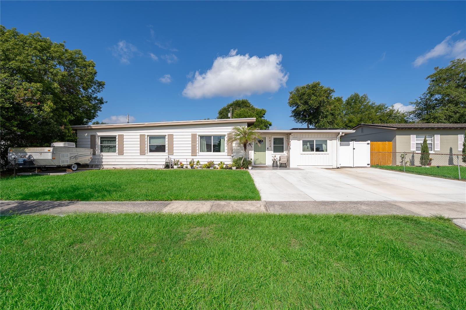 Come see this lovely 4 bedroom, 2 bath, one story home in Azalea Park! ROOF 2024* NEW HIGH IMPACT WINDOWS (up to 120MPH winds) 2025* FENCE 2025* ALL NEW LIGHT FIXTURES* NEW HIGH IMPACT FRONT DOOR* BOTH BATHROOMS FULLY UPDATED* TUFF SHED 2022* CONCRETE DW EXTENSION AND SLAB IN BACKYARD 2023. This perfect home also features beautiful PORCELAIN TILE flooring in bedrooms. Ceramic tile throughout living areas! Sliding doors in dining room lead to a large, fenced backyard with plenty of space for relaxing or entertaining! Location is convenient to shopping, restaurants, highways & more. Schedule your showing TODAY!