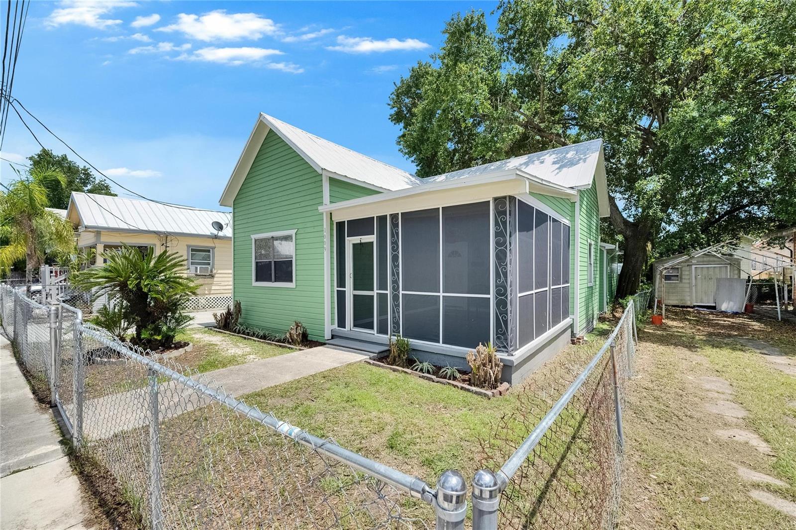 Fully Renovated Tampa Bungalow with Strong Income Potential – Minutes from Downtown!

Welcome to 1009 E Columbus Drive, a beautifully updated 3-bedroom, 2-bath home located in the heart of Tampa's rapidly growing Ybor City/MVMNT District corridor. Combining historic charm with modern upgrades, this property offers an exceptional opportunity for homeowners, investors, or those seeking a turnkey short-term rental.

Step inside to discover an open-concept living space featuring luxury vinyl plank flooring, recessed lighting, high ceilings, and a fully remodeled kitchen with quartz countertops, shaker-style cabinetry, stainless steel appliances, designer tile backsplash, and an oversized breakfast bar perfect for entertaining.

The spacious primary suite offers privacy and comfort, while both bathrooms have been tastefully renovated with contemporary finishes. A large indoor laundry room adds convenience and additional storage space.

Outside, the property truly shines with a unique backyard entertainment area featuring:

Outdoor grilling station
Custom putting greens
Picnic and gathering area
Privacy fencing
Bonus storage structure with artistic mural

Whether you're looking to host guests, enjoy outdoor living, or maximize rental appeal, this backyard is designed to impress.

Location is everything, and this property delivers. Conveniently situated just minutes from:

Downtown Tampa
Ybor City
Armature Works
Channelside District
Water Street Tampa
Tampa Riverwalk
Major highways, dining, nightlife, and entertainment

With Tampa continuing to experience significant growth and redevelopment, this property offers excellent income-producing potential as a primary residence, long-term rental, or short-term rental opportunity (buyer to verify local regulations).

Property Highlights:

? 3 Bedrooms | 2 Bathrooms
? Renovated Kitchen & Bathrooms
? Quartz Countertops & Stainless Appliances
? Luxury Vinyl Flooring Throughout
? Indoor Laundry Room
? Fully Fenced Yard
? Outdoor Entertainment Space with Putting Greens
? Minutes to Downtown Tampa & Ybor City
? Strong Rental & Investment Potential

Don't miss your chance to own a move-in-ready property in one of Tampa's most exciting and rapidly appreciating locations.