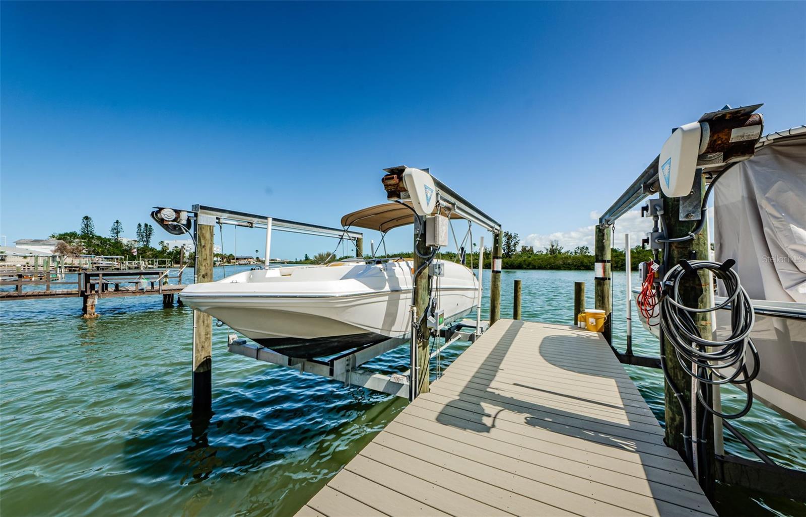 Beach + Boat Slip! Wake up to beautiful Intracoastal Waterway views and walk just steps to the beach from this spacious 3-bedroom + office corner condo located on Gulf Boulevard in desirable Redington Shores. This light-filled corner unit features newer windows, updated flooring, and an open layout designed for easy coastal living. Thoughtful touches like plantation shutters and blackout blinds in the primary suite add comfort and style. The bonus office/den provides flexible space for working from home or easily accommodating extra guests. Relax on your private balcony overlooking the Intracoastal, or take advantage of the brand-new (2024) private dock with lift, perfect for boating enthusiasts. Enjoy the community pool, under-building parking, and guest parking, with easy access to local favorites like Salt Rock Grill and the shops and restaurants at John's Pass Village & Boardwalk. Conveniently located near the beaches, dining, and entertainment of Indian Shores and Madeira Beach. Seller is motivated and owner financing may be available. A rare opportunity to own a spacious beachside condo with boating access—bring your offers. 90 day min rentals.