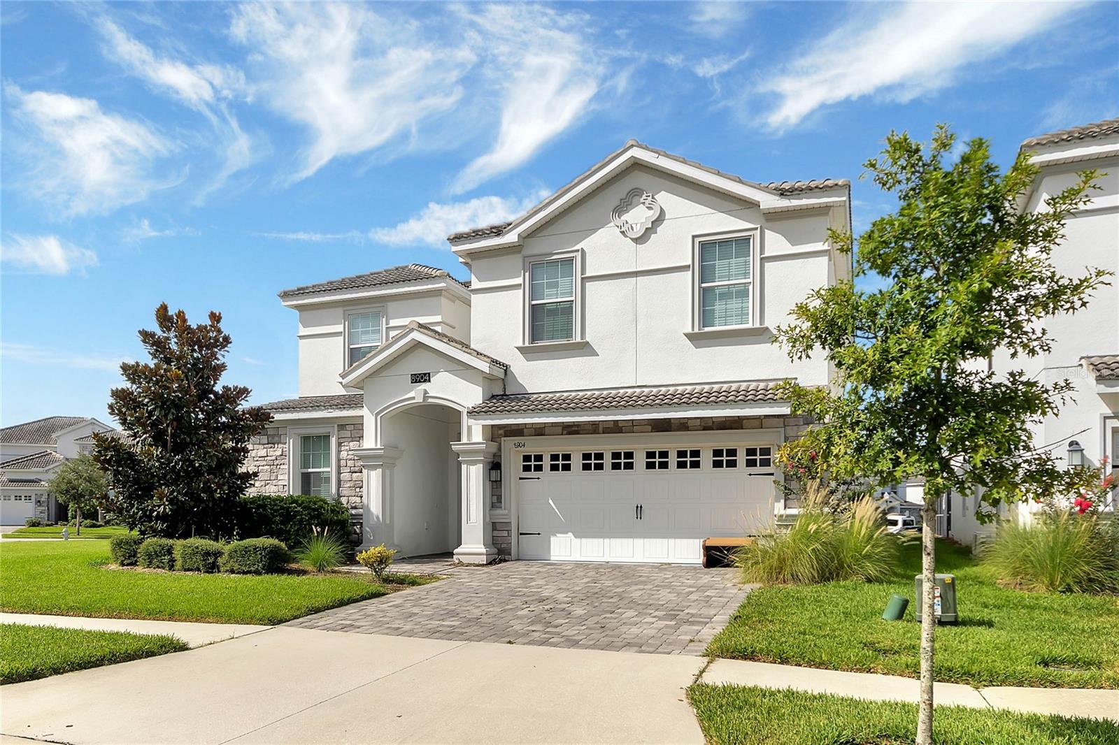 * PRICE IMPROVEMENT* Welcome home to 8904 Stinger Dr, a beautiful 8 bedroom 5 bathroom Lennar built home in the ChampionsGate resort in the heart of Central Florida's playground. **The Ultimate AIRBNB/VRBO/INVESTMENT PROPERTY with GREAT RENTAL HISTORY and FUTURE BOOKINGS can convey** LOCATION! larger than average corner lot, with a neighbor on only one side. Beautifully presented, freshly painted, elegant furnishings, the attention to detail is outstanding in this spectacular home. This stunning, turnkey home has the flair of the nearby attractions, perfect for ensuring that guests have a vacation to remember. Spacious, open floorplan with lots of additional space for fun: fully equipped & themed garage games room complete with arcade games, pool table, air hockey and a second floor bonus room with gaming screens/Xbox/Playstation. Second floor features an outstanding home theater with stacked seating & projector. This MAUI floorplan features 8 bedrooms and 5 bathrooms. 
Get the family together for a meal around the large dining table that has seating for 12, with additional breakfast bar seating, making it the perfect space to enjoy your slice of Florida. There is a master bedroom suite on the main level with bathroom that has convenient access to the pool deck. There is a second bedroom with ensuite bathroom on the main level. Upstairs there are 6 further bedrooms, all with stylish decor and thoughtful touches. The home features 2 Jack & Jill bathrooms and 2 themed twin rooms. Attention to detail and special touches are evident throughout this home. Everyone who has the pleasure of spending time in this vacation home will be impressed!
Enjoy the outdoor space complete with heated pool and spill over spa, this is the perfect place to unwind, relax and entertain after a long day enjoying all that Central Florida has to offer. Float around the pool, relax in the Spa, BBQ or enjoy some down time, the choice is yours. 8904 Stinger Dr is located on a larger than average size lot, benefits from a neighbor on only one side and a full privacy hedge around the pool screen. Guests can check out all of the leisure and recreation opportunities within the ChampionsGate resort. Your vacation will be spent surrounded by the utmost luxury at The Retreat at ChampionsGate. This esteemed one-of-a-kind resorts consists of vacation homes capable of catering to the most discerning guests. 
The Oasis club has a water park, lazy river, clubhouse, restaurant, cinema, heated pools, volleyball, tennis, fitness center, bar, grill and so much more. There is also a new water park within the resort as well as world class golf facilities located at ChampionsGate golf and country club, 18-hole championship course, pro-shop, restaurant and bar. This community features 24 hour security and is located close to the Omni resort, Reunion golf course and shopping and dining at ChampionsGate. Minutes from Disney and the world famous attractions area, this location is perfect for accessing all that the attractions area has to offer, yet is also your own private oasis. <iframe src="https://player.vimeo.com/video/857189931?h=f7e1a7559e&color=62a73b&byline=0&portrait=0" width="640" height="360" frameborder="0" allow="autoplay; fullscreen; picture-in-picture" allowfullscreen></iframe>
<p><a href="https://vimeo.com/857189931">8904 Stinger Drive, Davenport, FL 33896</a> from <a href="https://vimeo.com/devoredesign">DeVoreDesign</a> on <a href="https://vimeo.com">Vimeo</a>.</p>
