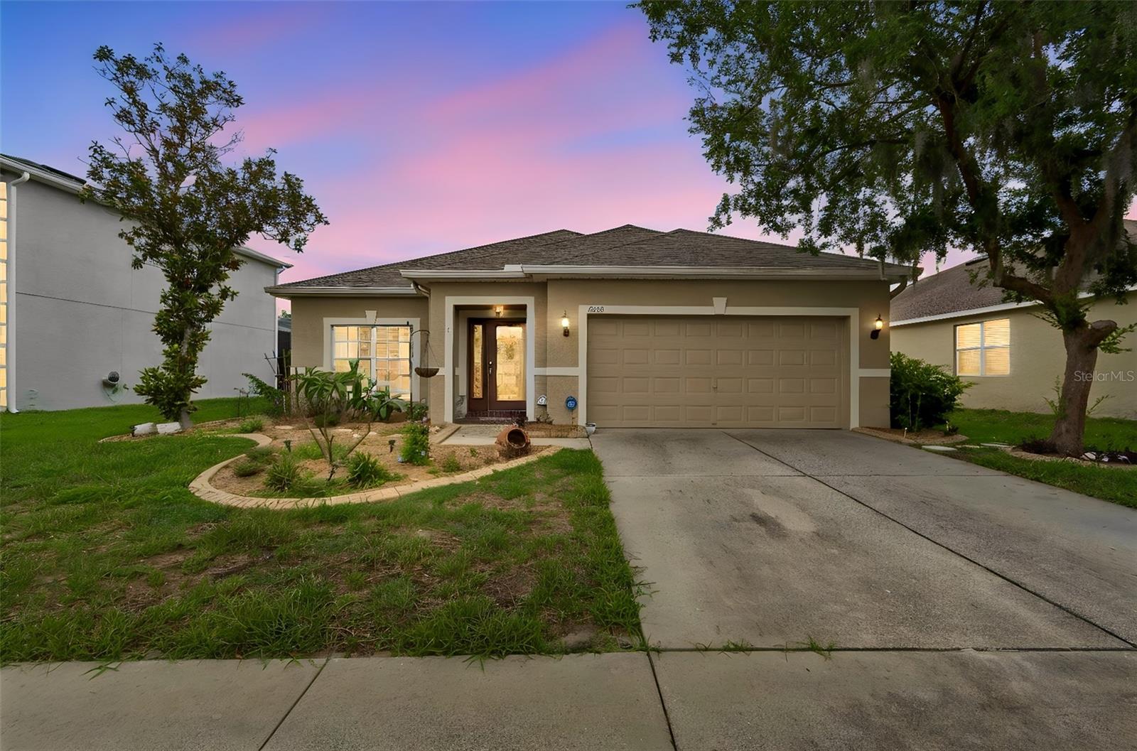 Short Sale. Welcome to this beautiful 3-bedroom, 2-bath pool home located in the highly desirable Dupree Lakes community in Land O’ Lakes. From the moment you enter, you’ll appreciate the bright and inviting living spaces filled with natural light from the large windows.
The open-concept floor plan seamlessly connects the kitchen, dining, and family room areas, all overlooking the sparkling pool and tranquil pond views. The kitchen is beautifully appointed with 42” staggered maple cabinets, a built-in wine rack, and plenty of space for entertaining. Luxury laminate flooring flows throughout the main living areas, complemented by tasteful neutral finishes and faux wood blinds throughout the home.
The spacious primary suite features a luxurious en-suite bathroom with a Jacuzzi tub, separate shower, dual vanities, and ample storage space. Step outside to your fenced backyard oasis complete with a private in-ground pool, covered sitting area, peaceful water views, and brick pavers at the entry for added curb appeal.
Residents of Dupree Lakes enjoy resort-style amenities including tennis courts, basketball courts, and a community pool, offering endless recreation and entertainment opportunities. This home truly has it all comfort, style, and the best of Florida living.