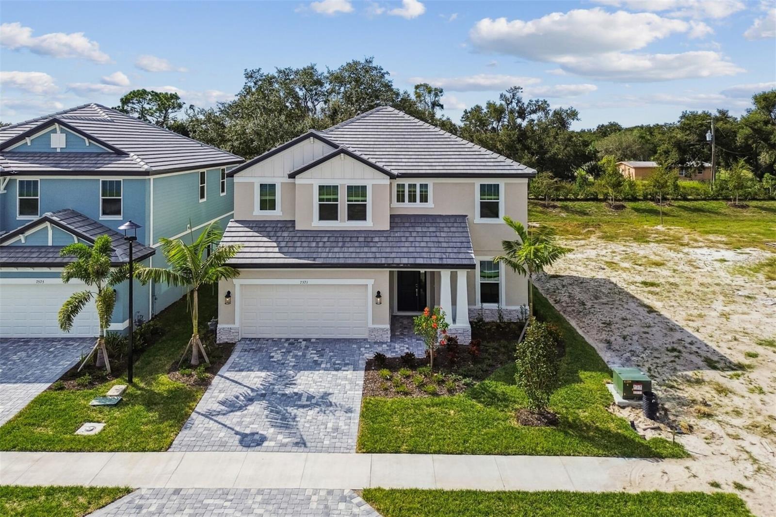 Natural light, spacious living areas, and a flexible floor plan come together to create a home you'll enjoy from day one. This beautifully designed Estuary floor plan located in the sought after Hawkstone community in Sarasota. Offering 3 bedrooms plus a Flex/ den, 2.5 bathrooms, a spacious loft, and a 2 car garage, this new construction home includes Impact windows and combines flexible living spaces with a functional layout ideal for today's lifestyle. The open concept design creates an inviting atmosphere where the kitchen, dining area, and great room flow together seamlessly. The kitchen features a large center island with seating, abundant cabinetry, generous counter space, and a walk in pantry, making it ideal for everyday living and entertaining. Sliding glass doors lead to the covered lanai, extending your living space outdoors. A private den near the front entry provides an excellent space for a home office, study, hobby room, or guest retreat. Upstairs, an open loft offers additional living space for a media room, game room, or second family room. The owner's suite is thoughtfully positioned for privacy and includes dual vanities, a soaking tub, separate shower, private water closet, and an oversized walk in closet. Two additional bedrooms each include walk in closets and share a full bathroom with dual sinks. The upstairs laundry room adds everyday convenience. Located in Hawkstone, this home offers convenient access to Lakewood Ranch, Siesta Key Beach, downtown Sarasota, top rated schools, shopping, dining, parks, golf, and major commuter routes. If you are searching for a new construction home in Sarasota with an open floor plan, home office, loft, covered lanai, and modern finishes, this home is ready to impress. ****SPECIAL FINANCING AVAILABLE FOR A LIMITED TIME ONLY FROM PREFERRED LENDER. RESTRICTIONS APPLY, FOR QUALIFIED BUYERS, SUBJECT TO APPLICABLE TERMS AND CONDITIONS. SUBJECT TO CHANGE WITHOUT NOTICE****