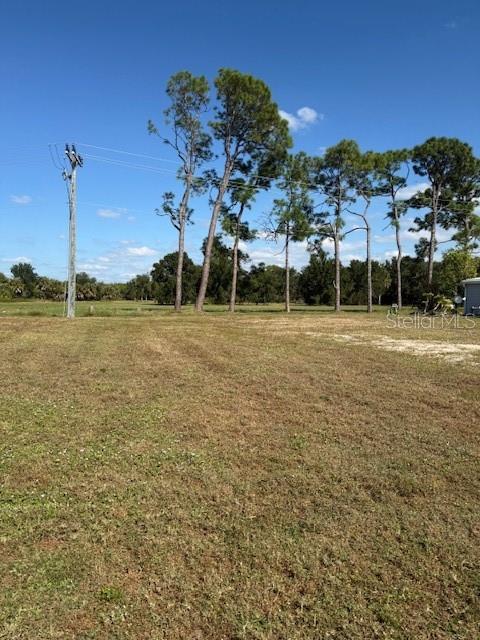 Spacious vacant lot in a vibrant 55+ community! This lot provides privacy by backing up to La Casa's 40 acres  La Casa offers the ultimate Florida lifestyle.  We have 974 home sites nestled among a variety of native trees with spacious common grounds surrounding our eight lakes.  La Casa is located between Sarasota and Fort Myers. We are convenient for shopping, sightseeing, golfing, fishing, and boating, as well as all the culture and elegance the Southwest Florida area is noted for. Wireless Internet (Wi-Fi) is available at the Clubhouse, Activity Building, and Recreation Hall area where these pools & spas are located, so you can catch some rays while you catch up on your email! Sound enticing? Come for a visit to this self-contained oasis and see for yourself why La Casa is the ultimate destination for both snowbirds and year-round residents!

Welcome to La Casa, an enchanting community where 974 exquisite homes are beautifully set among native trees, surrounded by spacious common areas and eight serene lakes. Our generous 60 by 80-foot lots offer your ideal space.  Perfectly located between Sarasota and Fort Myers, La Casa is a boater's paradise with direct access to the stunning Gulf of Mexico. Enjoy easy access to shopping, sightseeing, golfing, and fishing, all while immersing yourself in the rich culture of Southwest Florida.  Experience the warmth of Southwest Florida’s winters in a relaxed environment, far from the east coast hustle. Our lush, mature landscaping reflects the dedicated care of residents and management.  La Casa features some of the finest pools in the area, including our magnificent 40 by 60-foot swimming pool, maintained at a delightful 87 degrees, and a cozy 20 by 40-foot pool nestled between the clubhouse and Activity Building, both with inviting hot tubs.  Stay connected with our complimentary Wi-Fi at the Clubhouse, Activity Building, and Recreation Hall while you soak up the sun.  La Casa is a family-friendly haven where you can enjoy tranquility while remaining close to vibrant attractions. Come visit our charming oasis and discover why La Casa is the ultimate destination for snowbirds and year-round residents!