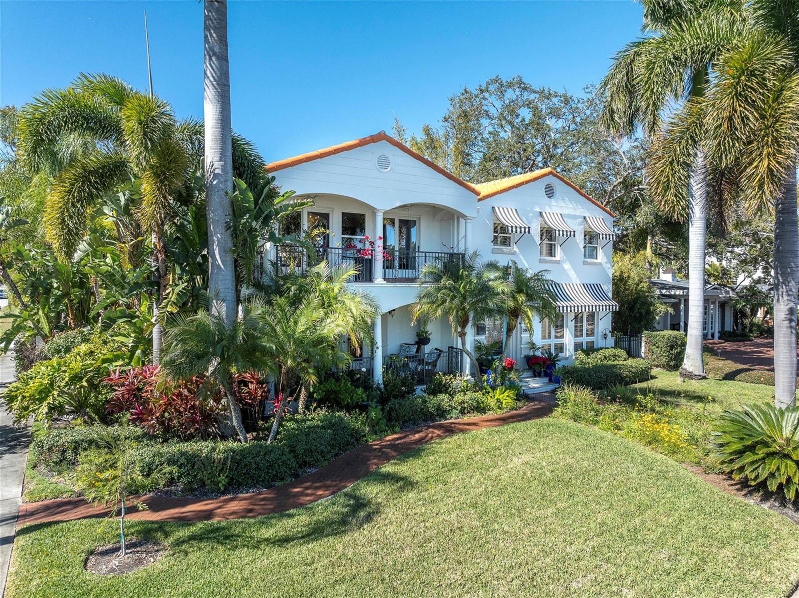 Welcome Home. This stunning waterfront Granada Terrace home is located on the prestige brick streets of the Old NE.  Enjoy walks to downtown St. Petersburg along the waterfront on beautiful Coffee Pot Bayou. Front your own dock with lifts for boats and kayaks while enjoying watching the Manatees feed and nurture their young. This home has a true estate size primary suite with walk-in closet, fireplace and private sitting room all overlooking the water from its own balcony.  Two other bedroom suites are also located on the 2nd floor. The main floor flows effortlessly as you enter into an elegant living room off of the open gourmet kitchen. A lovely dining room with a fireplace opens onto a balcony all facing the waterfront.  To the rear of the home is a large family room and guest suite alright off the courtyard pool.  Be ready to fall in love with your new home.