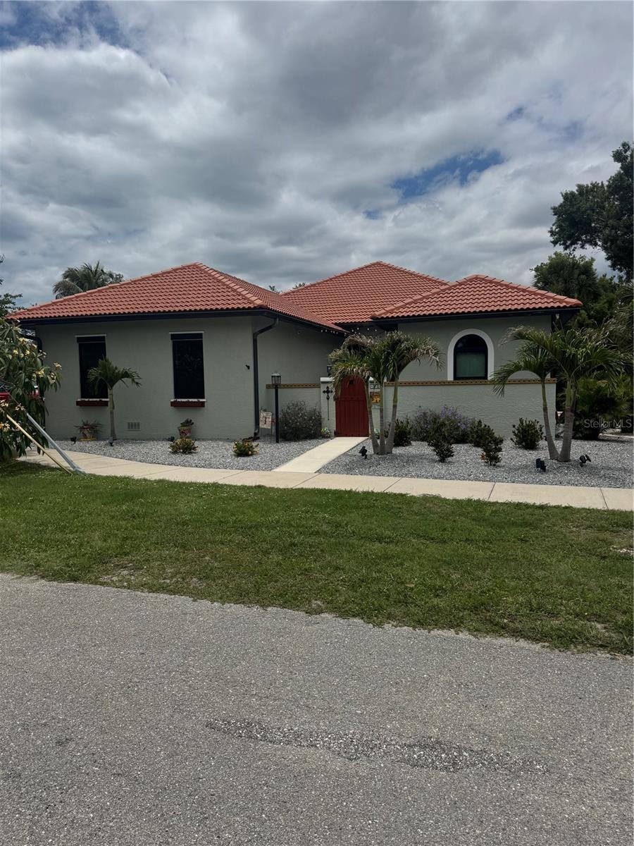 OWNER FINANCING; Term 4.5% at 15 Years, 10% Down.   Take advantage of this seller financing option and save money.  You can own this newly remodeled costal gem with 200,000. in upgrades-just minutes to the beach.  This Move-In Ready 3 bed, 2.5 bath home sits on a prime corner lot west of Highway 41 with no CDD fees.  Key Features: Hurricane Ready PGT windows, New A/C (2023), whole-house duct cleaning, New heavy duty water heater, Interior; new costal ceramic tile, fresh paint, 5” baseboards, new fixtures, vanities, stone counters, lighting, ceiling fans.  Chefs Kitchen; Bosch dishwasher, 6-burner Dacor stove, built-in Frigidaire Monogram refrigerator, Bathrooms have new tiled walk-in showers with a soaking tub in Master suite.  A 470 sq. ft. Lanai with outdoor kitchen.