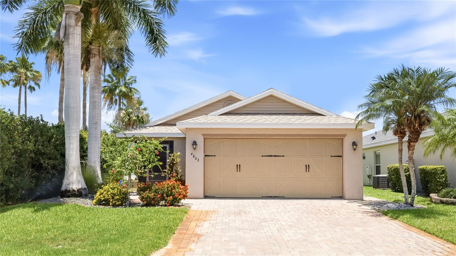 Welcome to the Cottages at San Casciano, a quiet enclave in Bradenton where this single-story home sits on a private corner lot bordered by lush hedgerow and a wide, open lake. Recent updates make it truly move-in ready, including a roof just about a year old, a brand-new dishwasher, fresh carpet in both bedrooms, a freshly painted interior, and an updated primary bath with a frameless glass shower door. The work is done, so you can simply settle in and enjoy the water. Inside, the open great room features soaring vaulted ceilings, easy-care tile flooring, and an abundance of natural light. The living room flows seamlessly into the dining area and a kitchen anchored by rich espresso cabinetry, generous counter space, a gas range, and a breakfast bar built for casual gatherings. Sliding glass doors off the dining area open to the extended paver patio, connecting indoor and outdoor living with ease. Tucked privately at the rear, the spacious primary suite is a true retreat with plush carpeting, a tray ceiling, and French doors that open right to the patio and lake. Its en-suite bath offers a dual-sink vanity and a separate glass-enclosed tiled shower, while a comfortable second bedroom and full guest bath sit on the opposite side of the home for ideal separation. The outdoor space is where this home sets itself apart. The fully fenced yard and extended paver patio deliver privacy, framed by mature greenery on one side and uninterrupted water views on the other. It is the perfect spot for morning coffee, evening grilling, or simply unwinding to the calm of the lake. An EV charger is located in the garage ready for your electric vehicle as well. Beyond the lot, the established community offers a tranquil setting that stays remarkably convenient. You are minutes from I-75, shopping, and dining, with the Manatee River, downtown Bradenton, and the Gulf Coast beaches of Anna Maria Island all within easy reach. Come experience the rare blend of privacy, water views, and location that makes this one feel like home. **THIS PROPERTY QUALIFIES FOR A 1% LENDER INCENTIVE IF USING PREFERRED LENDER. INQUIRE FOR MORE DETAILS.**