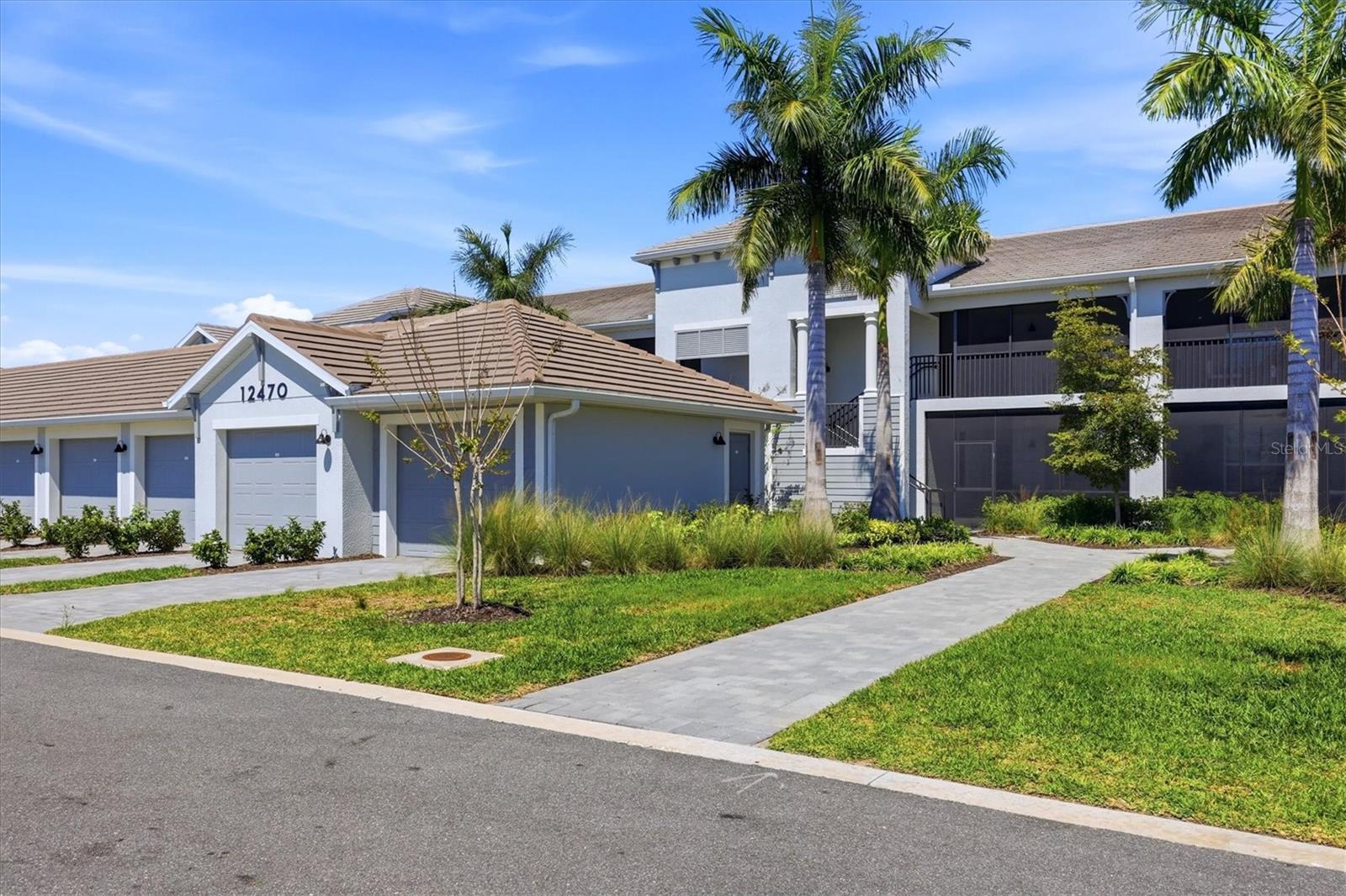 GOLF MEMBERSHIP INCLUDED + WATER & GOLF VIEWS — First-floor Veranda condo in Wellen Park Golf & Country Club featuring a bright, open layout and two screened lanais that make the most of Florida living. This 2-bedroom + den, 2-bath residence offers the popular Diangelo II floor plan, with a spacious great room that connects seamlessly to the dining area and kitchen. The kitchen is finished with 42” cabinetry, quartz countertops, stainless steel appliances, and a large island that anchors the main living space. The front lanai adds natural light and additional living area, while the rear lanai overlooks a peaceful combination of water and fairway views with easy walk-out access.
The primary suite includes ample closet space and an en-suite bath with dual vanities and a walk-in shower. A split-bedroom layout provides privacy for guests, and the den with French doors works well as an office, media room, or additional guest space. Hurricane impact windows and doors offer peace of mind, and a private 1-car detached garage adds convenience. Ownership includes access to the community’s resort-style amenities, including a zero-entry pool and spa, tiki bar, fitness center, tennis, pickleball, bocce, dog park, and full-service spa. The community continues to expand, enhancing both lifestyle and long-term value. Located just minutes from Downtown Wellen Park, CoolToday Park, Venice Island, Gulf beaches, shopping, dining, and I-75, this property offers a strong combination of location, views, and lifestyle.
With limited golf membership availability in future phases, this is a rare opportunity to secure golf access within Wellen Park Golf & Country Club.