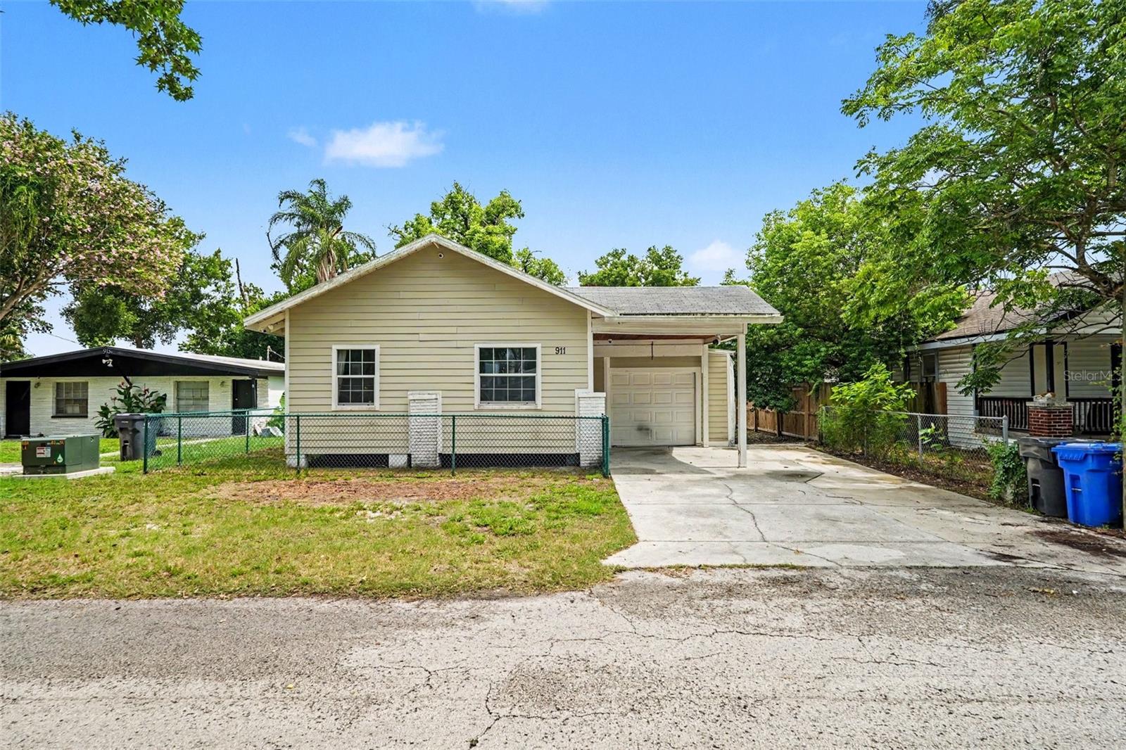 IDEAL OPPORTUNITY for investors or buyers looking for a starter home where they can build equity through renovation and restore its charm. 
This 2-bedroom, 1-bath home features a split floor plan and plenty of potential! 
The spacious primary bedroom offers two large walk-in closets, built-in shelving, plus additional closet space for exceptional storage. The second bedroom includes an adjoining flex area that's perfect for an office, nursery, sitting room, or hobby space. 
The updated kitchen boasts new cabinets, granite countertops, and newer appliances, providing a great foundation for everyday living.
An additional bonus area can be used as a workshop, workout space, or home office. The home includes newer windows, a 2019 A/C, a concrete patio (2021), and a storage shed. Outside, you'll find a covered lanai overlooking a generous backyard with room to build a pool or create your own backyard oasis. Additional features include a one-car garage, a one-car carport, and ample storage space. Conveniently situated near I-275, major roadways, shopping, dining, parks, USF, and many of Tampa's key destinations.
