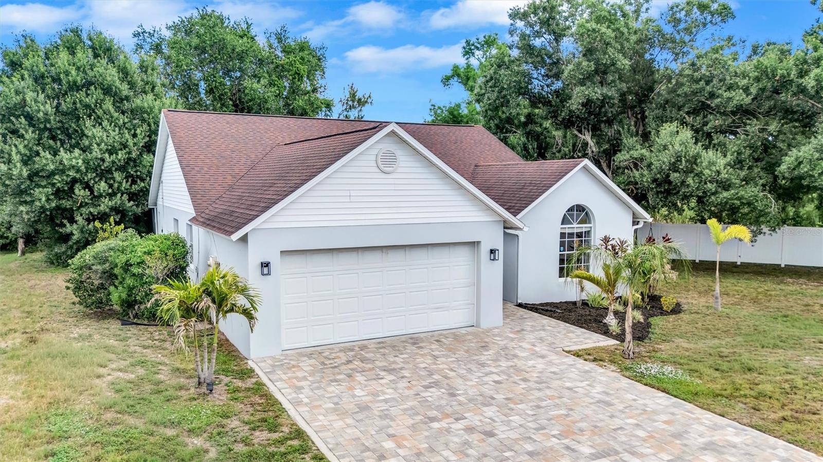 Tucked away on one of the most desirable streets in the community, this beautifully updated 3 Bedroom / 2 bath Bradenton caged chlorine Pool home (with new pool heater, with spa) retreat invites you to slow down, breathe deeper, and embrace the laid-back Florida lifestyle so many only dream about. Inside, 1,680 square feet of bright, open living space unfolds with warmth and ease. Luxury vinyl plank flooring flows throughout the home, creating a clean, modern feel that is both elegant and practical for everyday living. Sunlight pours into the spacious living (complete with cathedral ceilings) and dining areas, making the home feel open, cheerful, and welcoming from the moment you step inside. The thoughtfully designed layout offers the perfect balance between gathering spaces for entertaining and quiet retreats for relaxing after a day spent on the water or at the beach. Adding even more peace of mind, the home features a newer roof that offers meaningful insurance advantages and helps keep ownership expenses comfortably manageable. Whether you are searching for your very first home, a peaceful seasonal getaway, or a smart investment with low carrying costs and exceptional long-term value, this residence delivers an effortless blend of comfort, style, and opportunity. Outside is where this property truly becomes something special. Sitting on over a quarter of an acre, the oversized backyard feels like a private sanctuary, an increasingly rare luxury in today’s market. Imagine evenings beneath swaying palms, weekends building your dream outdoor kitchen and pool, or simply enjoying the serenity of having room to breathe. The possibilities are endless. Life here extends far beyond the property lines. Just a short stroll away, residents enjoy resort-inspired amenities including a waterfront pool, tennis and volleyball courts, gazebo, BBQ area, playground, and even a kayak launch for spontaneous afternoons on the water. Everyday conveniences like Publix, Costco, and Home Depot are moments away, while the public boat ramp is less than five minutes from your driveway, making coastal adventures part of your normal routine. Combined with the home’s size, condition, location, and community amenities, this property represents not only an incredible lifestyle opportunity, but also an exceptionally smart investment in one of Florida’s most desirable Gulf Coast regions.