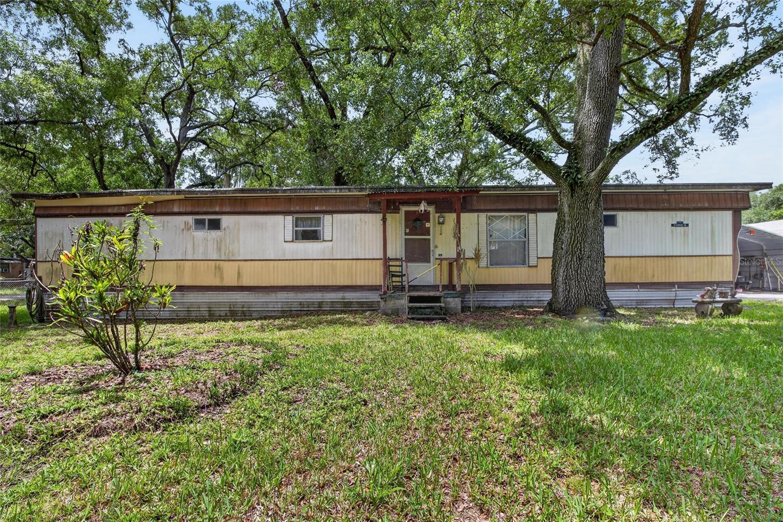 Welcome to 10227 Oak Ave, Tampa, FL! Situated on a spacious .24-acre lot with no HOA restrictions, this 2-bedroom, 2-bath mobile home offers affordability, flexibility, and plenty of outdoor space. The property features a functional floor plan, ample parking, and room for boats, RVs, trailers, or future improvements. Conveniently located near shopping, dining, schools, and major roadways, this property is ideal for homeowners, investors, or anyone looking to enjoy the freedom of homeownership without HOA fees. Don't miss this opportunity to own a generously sized lot in a growing Tampa location!