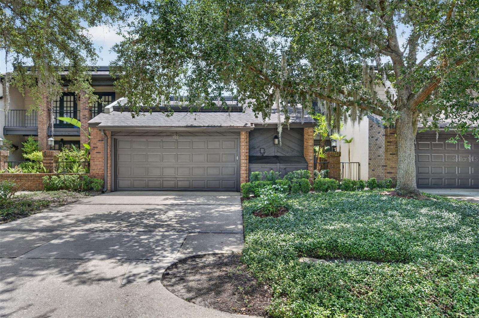 Completely reimagined in 2025, this stunning 2-bedroom, 2.5-bath townhome offers the perfect blend of modern luxury and an unbeatable Winter Park location. Just minutes from Rollins College, Park Avenue, boutique shopping, award-winning dining, and everything that makes Winter Park so desirable, this move-in-ready home has been thoughtfully renovated from top to bottom with timeless, designer-selected finishes.

The heart of the home is the beautifully redesigned kitchen featuring Sarah Sherman Samuel cabinetry and hardware, gorgeous marble countertops, a custom marble ledge, and all-new appliances. Throughout the home, you'll find new flooring, smooth-finished walls, fresh interior paint, recessed lighting with dimmers, updated electrical, new interior doors and hardware, and new baseboards, creating a clean, sophisticated aesthetic.

Upstairs, both spacious bedrooms feature beautifully updated en-suite bathrooms, while the primary suite includes a custom marble-top vanity and a thoughtfully designed built-in closet system. Every bathroom has been fully renovated with high-end finishes that elevate the home's overall design.

Step outside to your own private outdoor retreat featuring a large covered patio with low-maintenance turf—perfect for entertaining, relaxing, or enjoying your morning coffee year-round. Major mechanical updates provide added peace of mind, including a 2023 air handler, 2024 water heater, all-new A/C ductwork, and added attic insulation for improved energy efficiency.

With nearly every surface and major system thoughtfully updated, this exceptional Winter Park townhome offers luxurious, turnkey living in one of Central Florida's most sought-after neighborhoods.