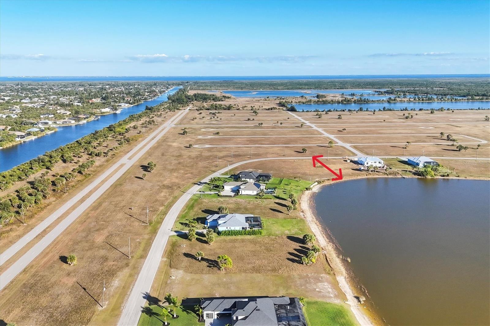 MOTIVATED SELLER. Lowest Priced Lake Front Lot with Western Views! This Over-Sized, Approved Building Lot with City Water & Sewer Welcomes you to this Sought-After Neighborhood, Rotonda Meadows! Build your Dream Home and bring your Kayaks! Build a Dock for the Ultimate Enjoyment! Low HOA-only $145/Year! Nearby features include Boating, Fishing, Golfing, Beaches and even a local Private Airport! Just Minutes to Boca Grande! Motivated Seller! Best Investment!