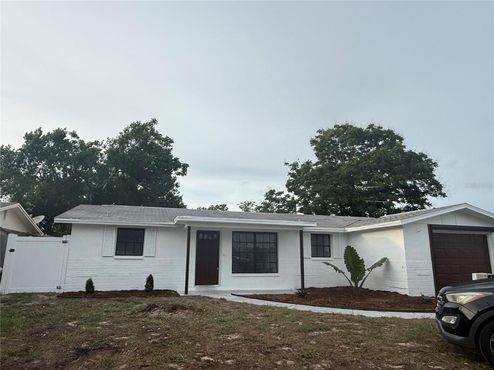 Welcome to this beautifully renovated single-story home, where modern style meets everyday comfort. The crisp white exterior, accented with bold black trim, creates a striking first impression and exceptional curb appeal.

Step outside to enjoy a spacious one-car garage, an extended driveway, and a welcoming front walkway leading to the entrance. Fresh landscaping, newly mulched flower beds, and a generous front yard enhance the home's inviting atmosphere while offering plenty of space for outdoor enjoyment.

Additional exterior highlights include a newer roof, oversized windows that provide abundant natural light, and a vinyl privacy fence, offering both security and seclusion.

Located in a quiet, established neighborhood, this move-in-ready home is the perfect blend of style, functionality, and convenience. Whether you're a first-time homebuyer, looking to downsize, or searching for your next investment, this beautifully updated property is ready to impress.

**Don't miss this incredible opportunity—schedule your private showing today!**