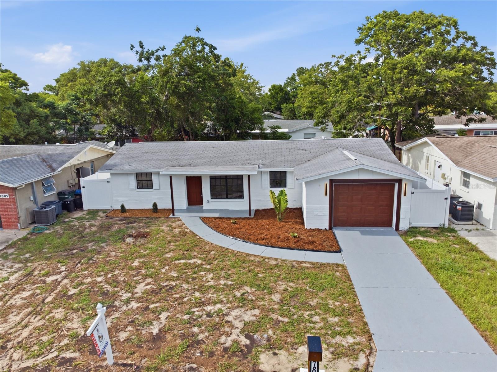 Welcome to this beautifully renovated single-story home, where modern style meets everyday comfort. The crisp white exterior, accented with bold black trim, creates a striking first impression and exceptional curb appeal.

Step outside to enjoy a spacious one-car garage, an extended driveway, and a welcoming front walkway leading to the entrance. Fresh landscaping, newly mulched flower beds, and a generous front yard enhance the home's inviting atmosphere while offering plenty of space for outdoor enjoyment.

Additional exterior highlights include a newer roof, oversized windows that provide abundant natural light, and a vinyl privacy fence, offering both security and seclusion.

Located in a quiet, established neighborhood, this move-in-ready home is the perfect blend of style, functionality, and convenience. Whether you're a first-time homebuyer, looking to downsize, or searching for your next investment, this beautifully updated property is ready to impress.

**Don't miss this incredible opportunity—schedule your private showing today!**