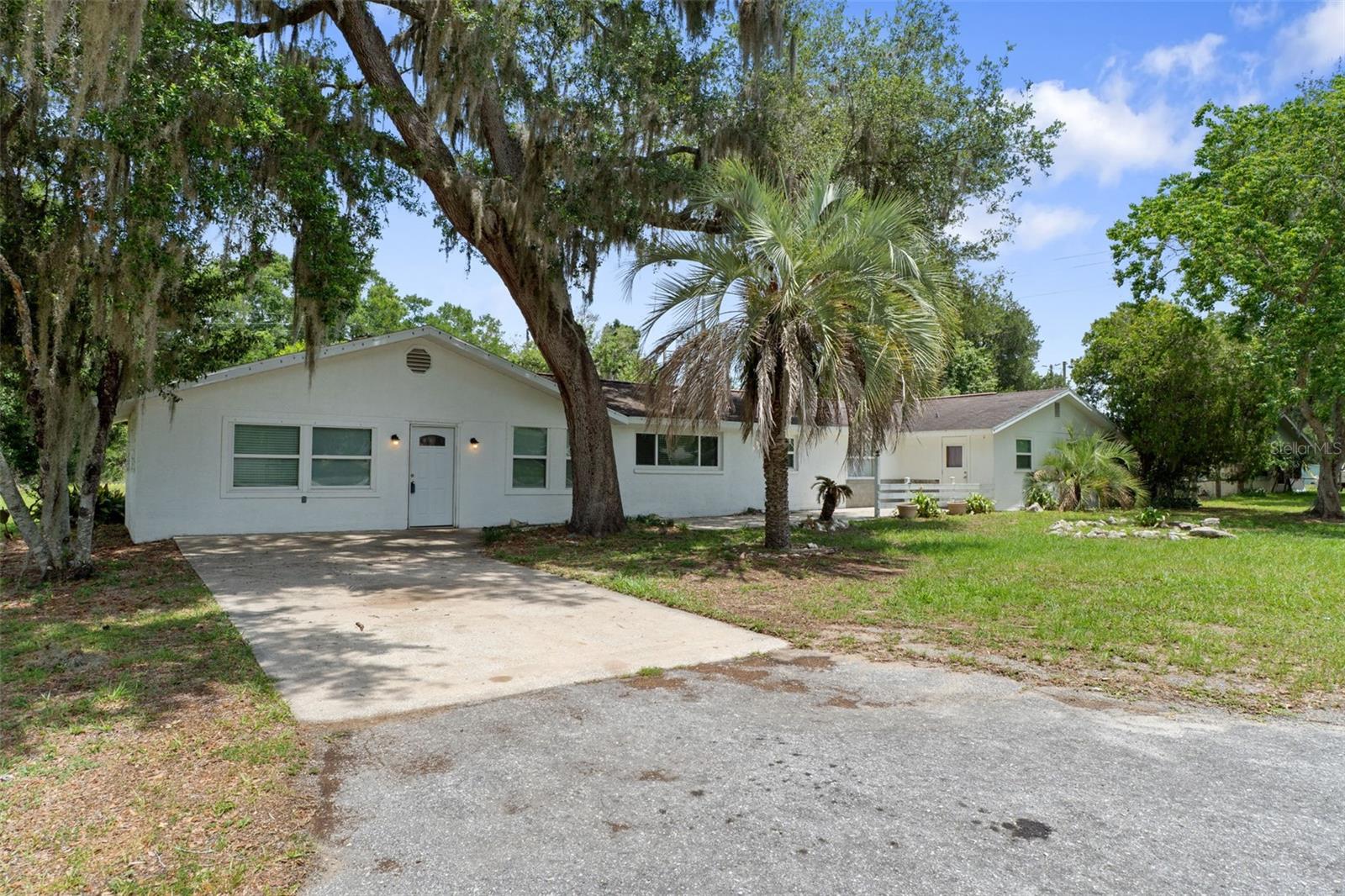 Welcome to this one-of-a-kind property in Floral City offering the perfect blend of space, flexibility, and charm! Situated on a generous .46-acre lot, this incredibly spacious home features 3 bedrooms plus 3 additional bonus spaces that can easily be used as offices, hobby rooms, guest areas, playrooms, or extra storage to fit your lifestyle needs. Inside, you'll find both a large living room and a separate family room, giving plenty of room for entertaining, relaxing, or creating separate gathering spaces for family and guests. The kitchen is equipped with stainless steel appliances, including a newer refrigerator, making it both functional and stylish for everyday living. Throughout the home, you'll appreciate the character and versatility of the mixed flooring, featuring a combination of tile and laminate wood that adds warmth and durability to the space. Major updates include windows replaced in 2019, helping improve efficiency and comfort. With its unique layout, oversized interior, and nearly half-acre setting, this property offers endless possibilities for anyone looking for a home with room to spread out both inside and out in beautiful Floral City.