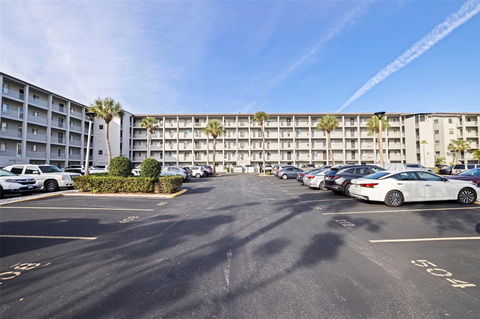 Peaceful Lake Views!! Enjoy tranquil water views from this well-maintained 3rd-floor condo in the desirable Bayshore on the Lake, a 55+ community just minutes from the world-famous Gulf beaches. Some photos virtually staged. This well-managed building is known for its lower HOA fees which includes cable and internet. A spacious 2-bed, 2-bath residence offers an open floorplan with a newly painted interior. Gently used only a few months each year and never rented. Take in serene lake views from the large screened lanai (which spans the width of the condo and includes a laundry closet with washer/dryer hookups) perfect for enjoying morning coffee or evening cocktails. Steps away is the community pool and clubhouse adding to the enjoyment of everyday living. Situated close to dining, shopping, and local attractions, this peaceful retreat offers the perfect balance of convenience and tranquility. If you’re looking for a full-time residence, seasonal getaway, or future investment, this unit checks all the boxes. Elevator access makes reaching your home a breeze. Schedule your private showing today! Some photos virtually staged. Seller is offering a 13-month home warranty with HWA Home Warranty to the buyer paid at close of escrow.