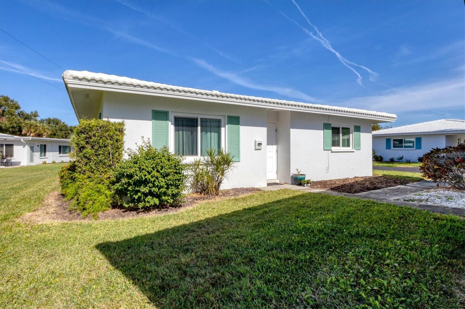 Located in the heart of Sarasota, this desirable 55+ community offers the perfect combination of comfort, convenience, and the Florida lifestyle. Residents enjoy a variety of amenities included in the low HOA fee, such as a community pool, shuffleboard courts, clubhouse, recreational facilities, basic cable, landscaping, and more. World-famous Siesta Key Beach and Lido Key Beach are only few miles away.
This rare free-standing, maintenance-free villa in the Strathmore community features 1 bedroom, a den, and 1 bathroom with many recent upgrades. In 2023, hurricane-impact, double-pane insulated windows were installed, along with new hurricane-impact front and back doors. The HVAC system was replaced in 2024, and all water lines have been re-piped with CPVC.
The bathroom has been beautifully updated with grab bars, a built-in nook, bench seating, a new toilet, faucet, fixtures, and mirror. The kitchen has been refreshed with new LED ceiling lighting, freshly painted cabinets, and updated hardware. Additional improvements include new ceiling fans, blinds, curtain rods, and curtains throughout the home.
The unit does not currently have a washer and dryer; however, the storage room under the carport could be converted into a laundry room with a stackable washer and dryer. Conveniently located just a few steps from the villa is the community laundry facility, where residents can use coin-operated washers and dryers.
The low HOA fee covers water, sewer, internet, cable, trash, lawn care, landscaping, irrigation, roof repairs, exterior pest control, clubhouse access, community pool, and much more.
Bobby Jones Golf Club is just minutes away, along with a nearby dog park and beautiful green spaces for walking, running, and biking. The community is conveniently located only 10 minutes from UTC Mall and downtown Sarasota, with easy access to shopping, dining, entertainment, and cultural attractions.
