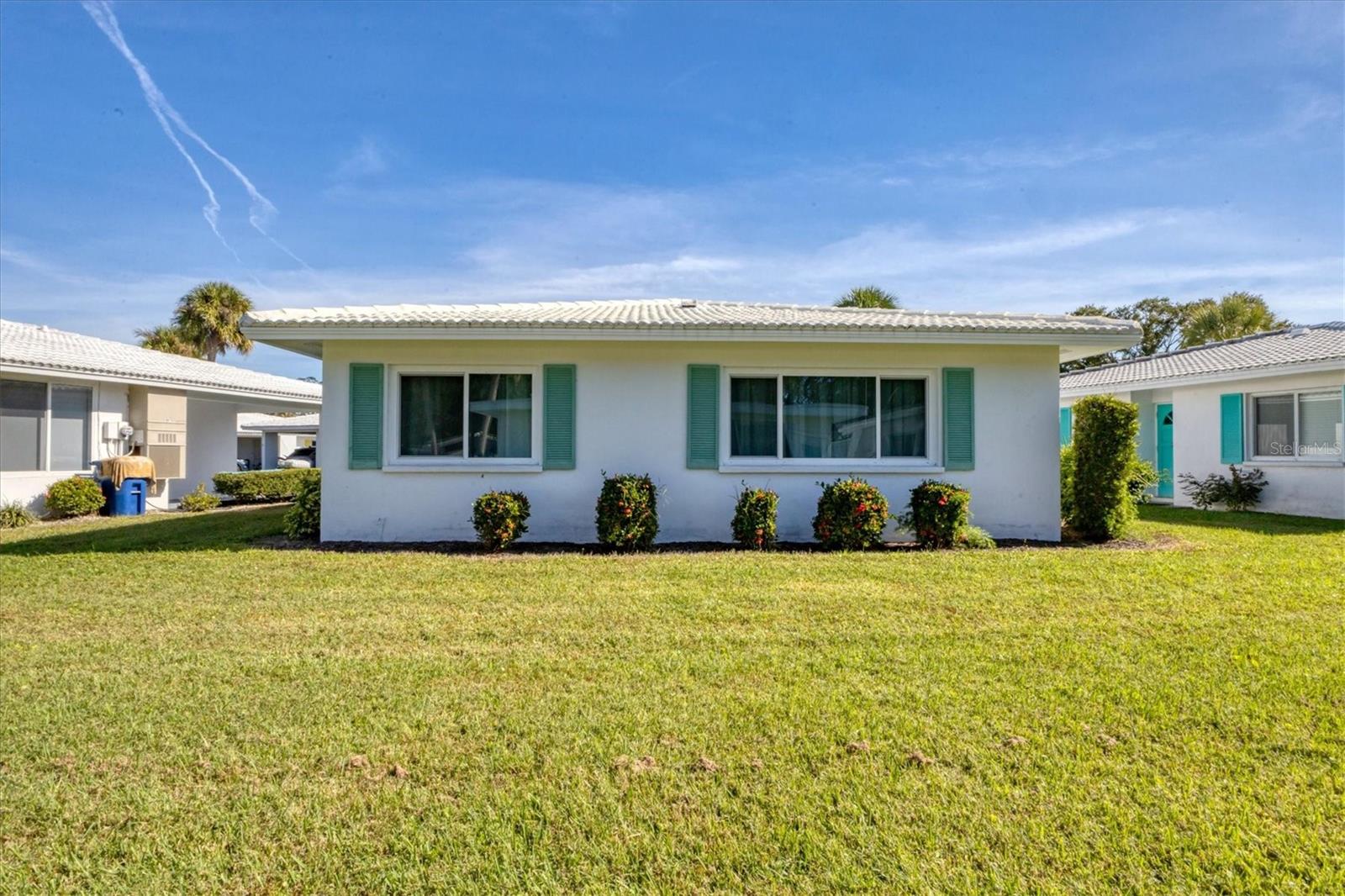 Located in the heart of Sarasota, this desirable 55+ community offers the perfect combination of comfort, convenience, and the Florida lifestyle. Residents enjoy a variety of amenities included in the low HOA fee, such as a community pool, shuffleboard courts, clubhouse, recreational facilities, basic cable, landscaping, and more. World-famous Siesta Key Beach and Lido Key Beach are only few miles away.
This rare free-standing, maintenance-free villa in the Strathmore community features 1 bedroom, a den, and 1 bathroom with many recent upgrades. In 2023, hurricane-impact, double-pane insulated windows were installed, along with new hurricane-impact front and back doors. The HVAC system was replaced in 2024, and all water lines have been re-piped with CPVC.
The bathroom has been beautifully updated with grab bars, a built-in nook, bench seating, a new toilet, faucet, fixtures, and mirror. The kitchen has been refreshed with new LED ceiling lighting, freshly painted cabinets, and updated hardware. Additional improvements include new ceiling fans, blinds, curtain rods, and curtains throughout the home.
The unit does not currently have a washer and dryer; however, the storage room under the carport could be converted into a laundry room with a stackable washer and dryer. Conveniently located just a few steps from the villa is the community laundry facility, where residents can use coin-operated washers and dryers.
The low HOA fee covers water, sewer, internet, cable, trash, lawn care, landscaping, irrigation, roof repairs, exterior pest control, clubhouse access, community pool, and much more.
Bobby Jones Golf Club is just minutes away, along with a nearby dog park and beautiful green spaces for walking, running, and biking. The community is conveniently located only 10 minutes from UTC Mall and downtown Sarasota, with easy access to shopping, dining, entertainment, and cultural attractions.