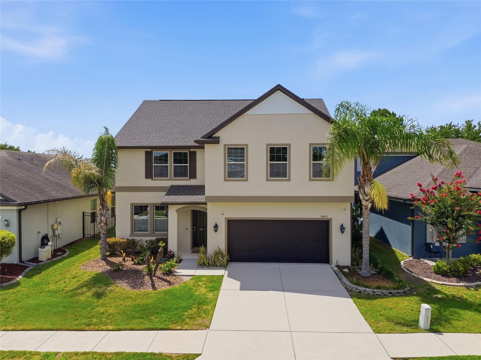 Welcome to this stunning 5-bedroom, 4-bathroom home offering 3,098 heated square feet of beautifully designed living space on a premium conservation lot in the heart of Wesley Chapel. Built in 2016 and loaded with upgrades, this move-in-ready home combines space, comfort, privacy, and exceptional value.

Step inside to discover fresh interior paint, brand-new carpeting, a dedicated office with a secure safe room, formal dining room, spacious family room, and an upstairs loft, providing flexible living spaces for work, relaxation, and entertaining. The gourmet kitchen features granite countertops, a large center island, 42-inch cabinetry, stainless steel appliances, and an open-concept design that flows seamlessly into the family room, making it the perfect space for gatherings and everyday living.

The luxurious primary suite offers a huge walk-in closet and spa-like bathroom with dual vanities, a garden tub, and separate tiled shower. Two secondary bedrooms share a convenient Jack-and-Jill bathroom, while the additional bedrooms and baths provide plenty of space for guests or multi-generational living.

One of the home's most spectacular features is the backyard retreat. The expansive 33' x 19' screened lanai overlooks a serene conservation area with no rear neighbors, creating a peaceful and private setting. Beautiful landscaping transforms the backyard into a true outdoor oasis, where you can enjoy your morning coffee, entertain family and friends, or simply relax while taking in the picturesque conservation views and abundant natural beauty.

Recent upgrades include a NEW ROOF, fresh exterior and interior paint, brand-new carpet, spray foam attic insulation, whole-house dehumidifier with UV light, new drainage system along the right side of the home, and a 5-year-old A/C system for added efficiency and peace of mind.

Residents enjoy resort-style amenities including a clubhouse, community pool, playground, basketball courts, tennis courts, soccer field, and dog park. Even better, the HOA includes Spectrum cable and high-speed internet.

Conveniently located near I-75 and I-275, you'll be just minutes from top-rated schools, shopping, dining, hospitals, and all that Wesley Chapel has to offer.

This exceptional home truly has it all—space, upgrades, privacy, and an unbeatable location. From the spectacular conservation views and lush backyard oasis to the thoughtfully designed interior, this home is ready to impress. Schedule your private showing today!