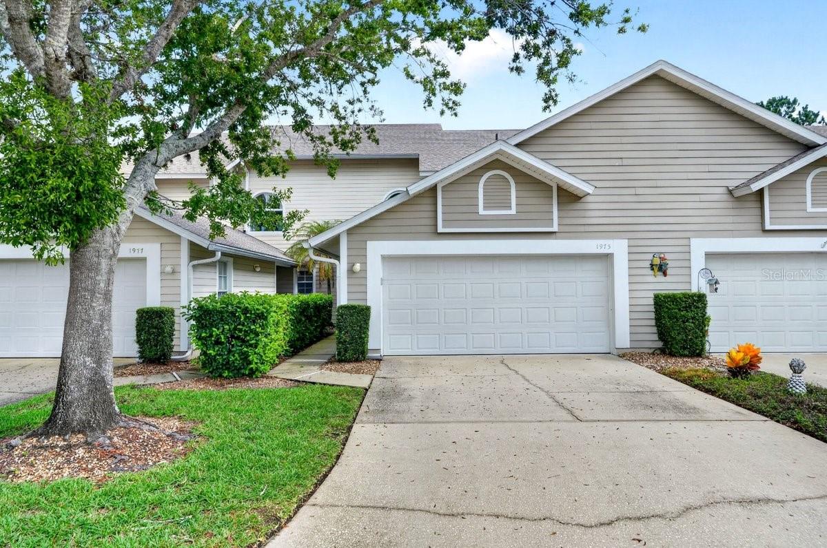 Move-In Ready Golf Course Condo in the Heart of Port Orange's Coveted Spruce Creek Fly-In Community! Experience the perfect blend of luxury, space, and low-maintenance living in this beautifully maintained 2-story condo-style home featuring 3 bedrooms, 2 full bathrooms, 1 half bath, and a spacious 2-car garage. Located in the world-famous Spruce Creek Fly-In, one of Florida's most sought-after gated golf course and aviation communities, this vacant home is move-in ready and waiting for its next owner.

From the moment you step inside, you'll be welcomed by soaring ceilings, abundant natural light, and an open, airy floor plan that feels both elegant and inviting. The spacious living room is ideal for entertaining or relaxing, while the oversized kitchen offers abundant cabinetry, generous counter space, a breakfast bar, and plenty of room for preparing meals and gathering with family and friends. The adjoining dining area flows seamlessly into the living space, creating an ideal layout for everyday living.

The first-floor primary suite offers privacy and convenience with a spacious en-suite bathroom featuring dual vanities, a large walk-in shower, and an impressive custom walk-in closet. Upstairs, you'll find two additional generously sized bedrooms and a full bathroom, providing ample space for family, guests, or a home office.

Enjoy peace of mind with a new A/C system, adding comfort and efficiency for years to come. Step outside to enjoy peaceful mornings or relaxing evenings overlooking the beautifully maintained golf course, where scenic fairway views create a tranquil backdrop year-round. Whether you're sipping your morning coffee or unwinding after a long day, this home offers the Florida lifestyle buyers are searching for.

Additional highlights include an interior laundry room, abundant storage, neutral finishes throughout, and a spacious 2-car attached garage. Best of all, this home is vacant and truly turnkey, allowing you to move in and immediately begin enjoying everything this exceptional community has to offer.

Living in Spruce Creek Fly-In means access to an unmatched lifestyle with 24-hour gated security, beautifully maintained grounds, golf, tennis, pickleball, walking and biking paths, parks, optional country club memberships, and the famous private airport community known worldwide among aviation enthusiasts. Conveniently located just minutes from shopping, dining, hospitals, I-95, Daytona Beach, New Smyrna Beach, top-rated schools, and the beautiful Atlantic beaches, you'll enjoy both convenience and prestige.

Whether you're searching for a Port Orange golf course home, Spruce Creek Fly-In home for sale, maintenance-free Florida home, move-in ready home, primary residence, vacation home, or seasonal retreat, this exceptional property offers the location, lifestyle, and updates today's buyers are looking for. Don't miss this rare opportunity to own a golf course home in one of Port Orange's premier gated communities--schedule your private showing today!