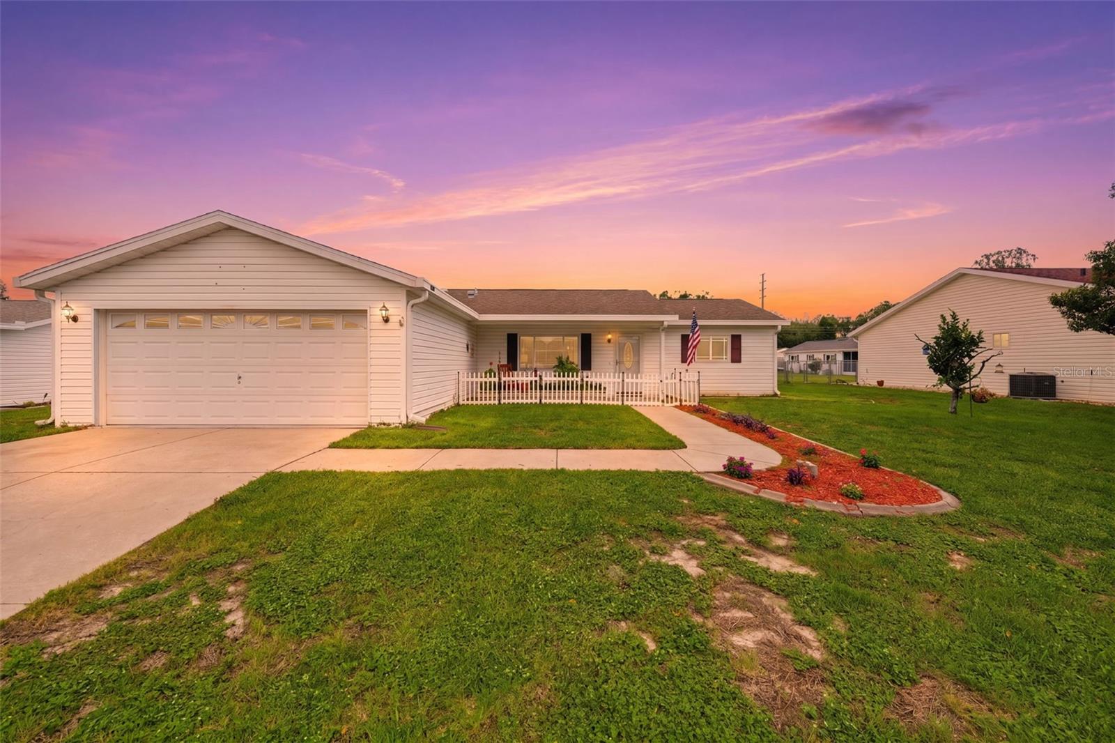 Brand new roof coming prior to closing and 2021 HVAC! This spacious Chestnut Extended model offers a full-sized additional 3rd bedroom (without closet) and additional living area under air! Natural light pours throughout the home thanks to solar tubes, while ceramic tile flooring throughout the main living areas and new remote-controlled ceiling fans provides both style and easy maintenance. The kitchen is equipped with a smart LG refrigerator, stainless steel dishwasher, over the range microwave, and includes the washer and dryer, making this home truly move in ready. Step outside and enjoy the beautifully landscaped yard and fully fenced backyard, perfect for pets and outdoor enjoyment. The under air enclosed lanai allows for flexible outdoor living space. The impressive 25' x 13' open air patio features lattice fencing and decorative rope lighting, creating the perfect setting for relaxing evenings or entertaining guests. Located in Spruce Creek South allowing residents to enjoy an active lifestyle with access to golf (golf membership required), pickleball, tennis, shuffleboard, a community heated pool, fitness center, dog park, walking trails, on site dining, and a full calendar of social activities. Conveniently located near shopping, dining, medical facilities like the VA Clinic and less than 1 mile from The Villages with free nightly entertainment! This home offers the perfect blend of comfort, convenience, and community living. Schedule your private showing today!